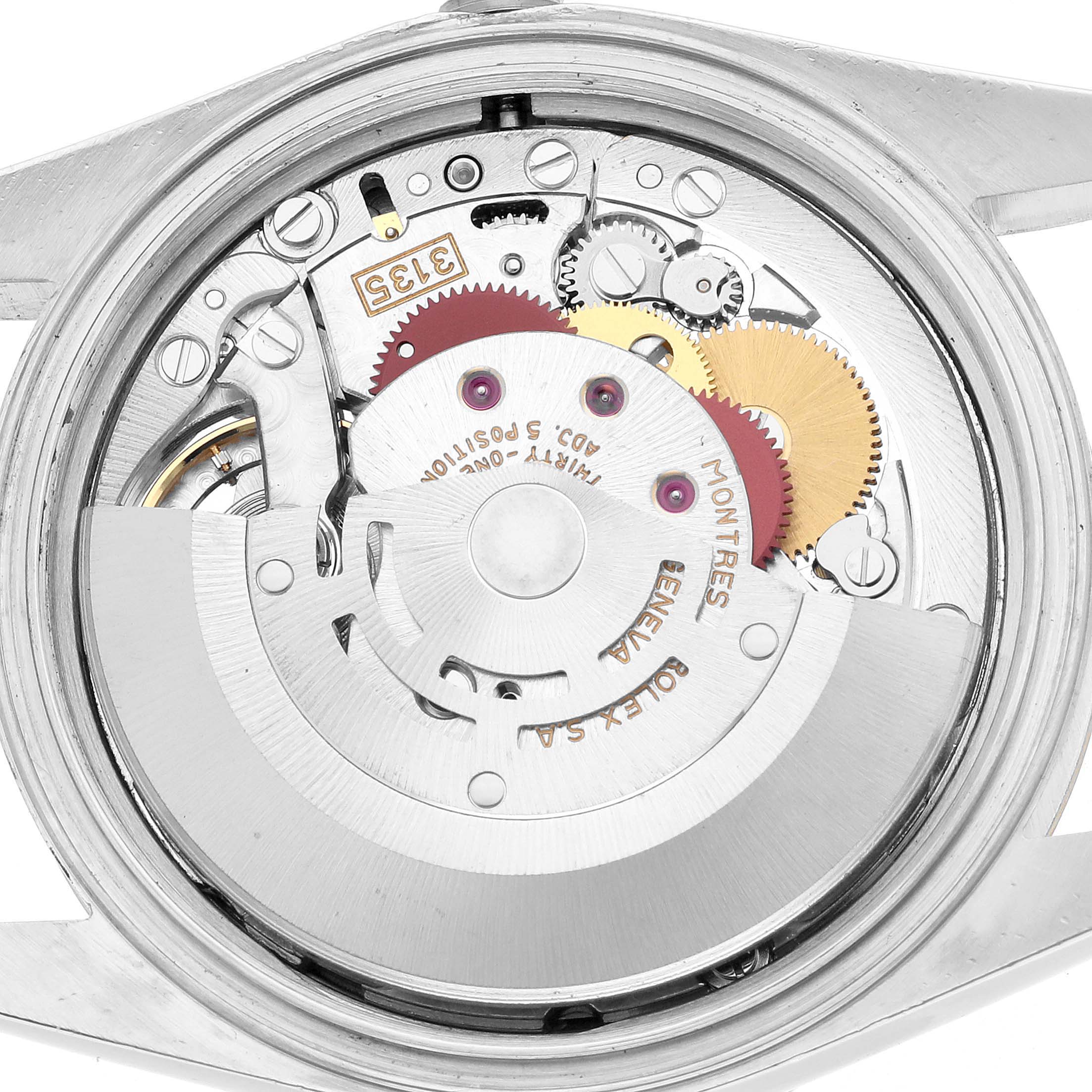 The image shows the movement of a Rolex Datejust 16233 Men's Steel and Gold (two tone) Champagne Dial, viewed from the back with gears and components visible.