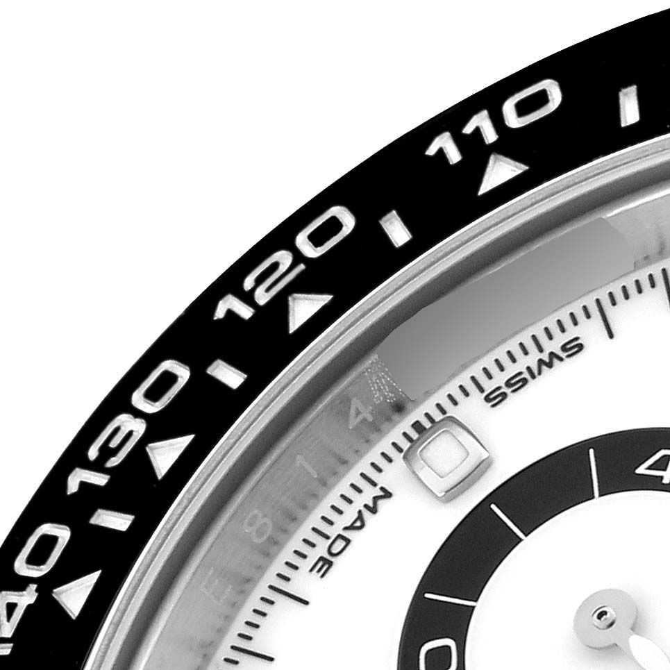 The image shows a partial view of the bezel and dial of a Rolex Daytona 116500LN Men's Stainless Steel White Dial 116500LN Men's Stainless Steel White Dial, focusing on the tachymeter markings.