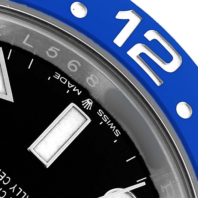 The image shows a close-up of the bezel, dial, and hour marker of a Rolex GMT-Master 126710BLNR Men's Stainless Steel Black Dial watch.