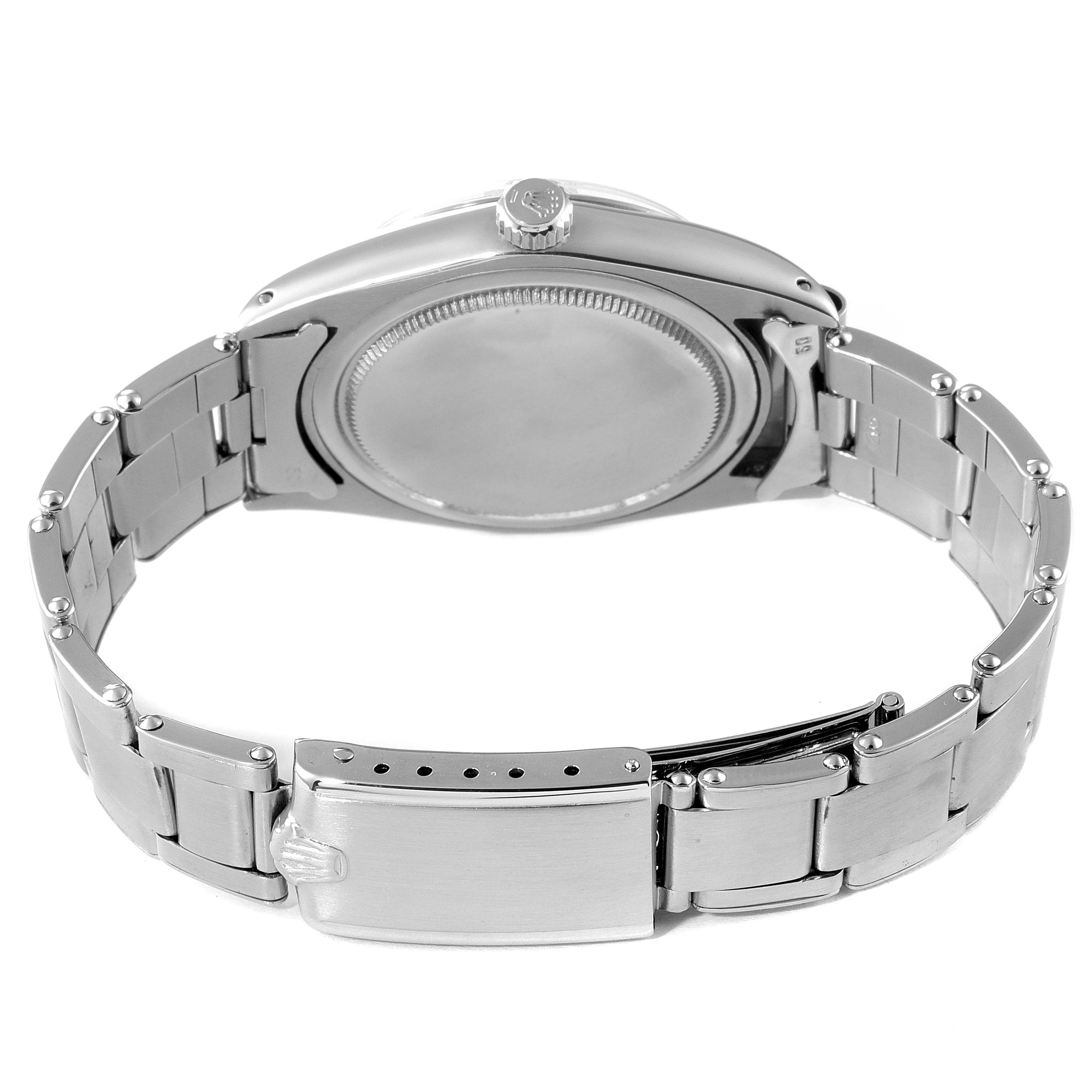 The image shows the back case and bracelet of the Rolex Vintage Collection 6694 Men's Stainless Steel Black Dial 6694 Men's Stainless Steel Black Dial watch.