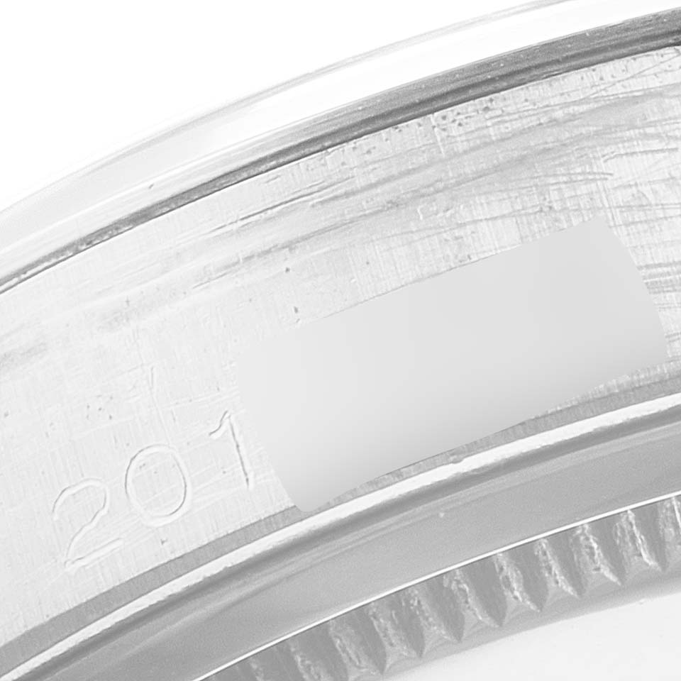 This close-up image shows the serial number engraving on the edge of the case of a Rolex Vintage Collection 6694 Men's Stainless Steel Black Dial 6694 Men's Stainless Steel Black Dial watch.