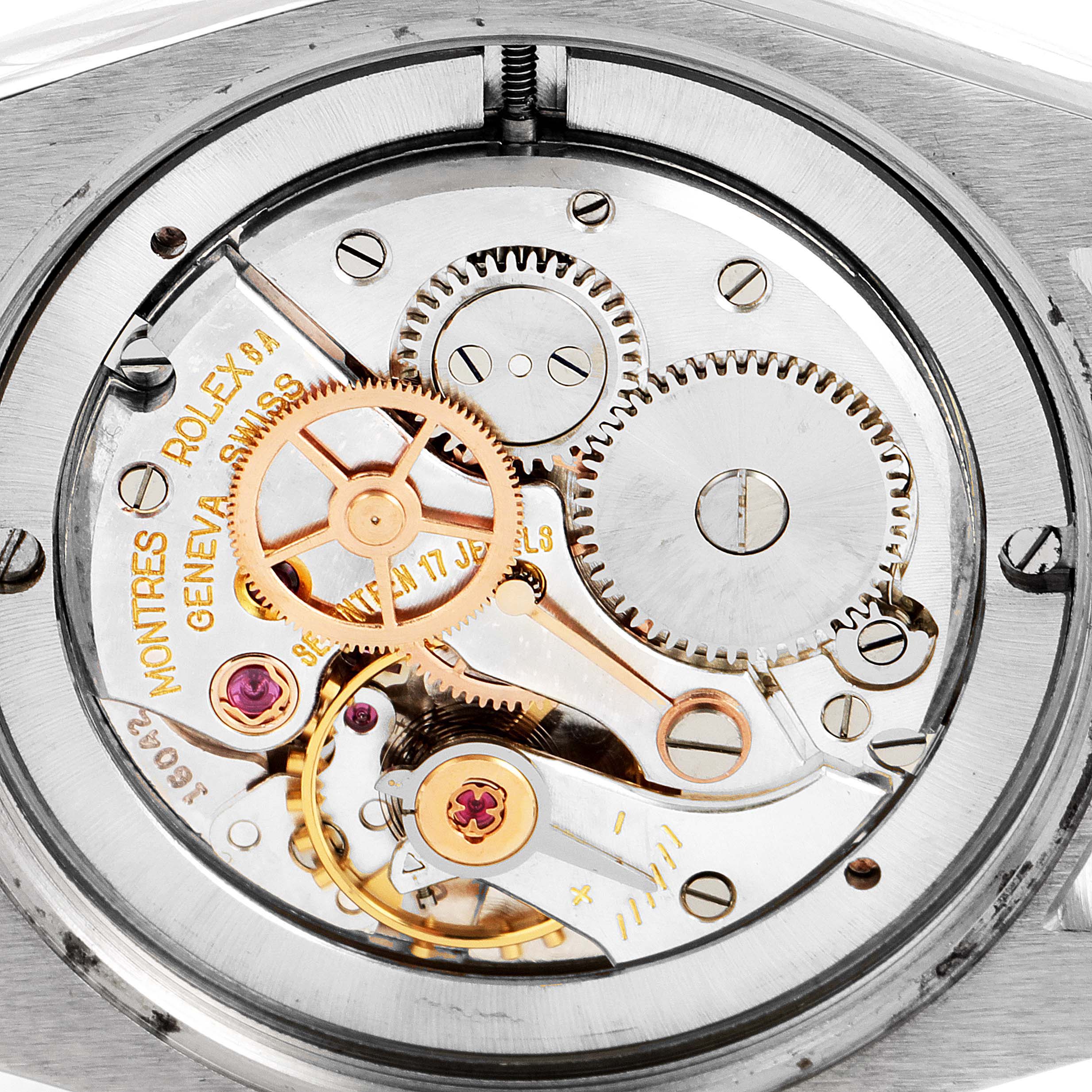 The image shows the movement mechanism and gears of the Vintage Collection Rolex watch from the back.