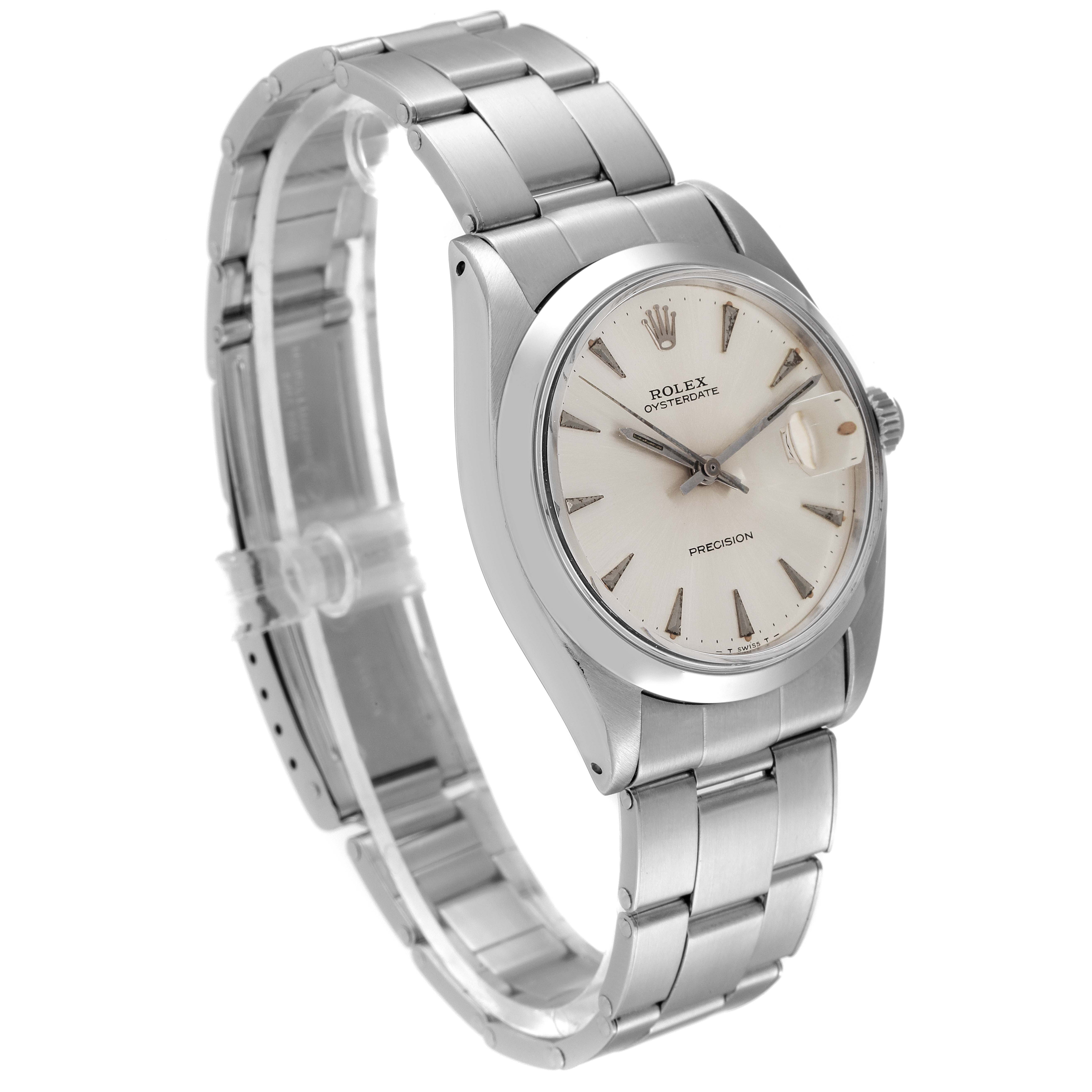 This image shows a Vintage Collection Rolex Oysterdate watch at a three-quarter angle, highlighting its dial, bezel, and bracelet.