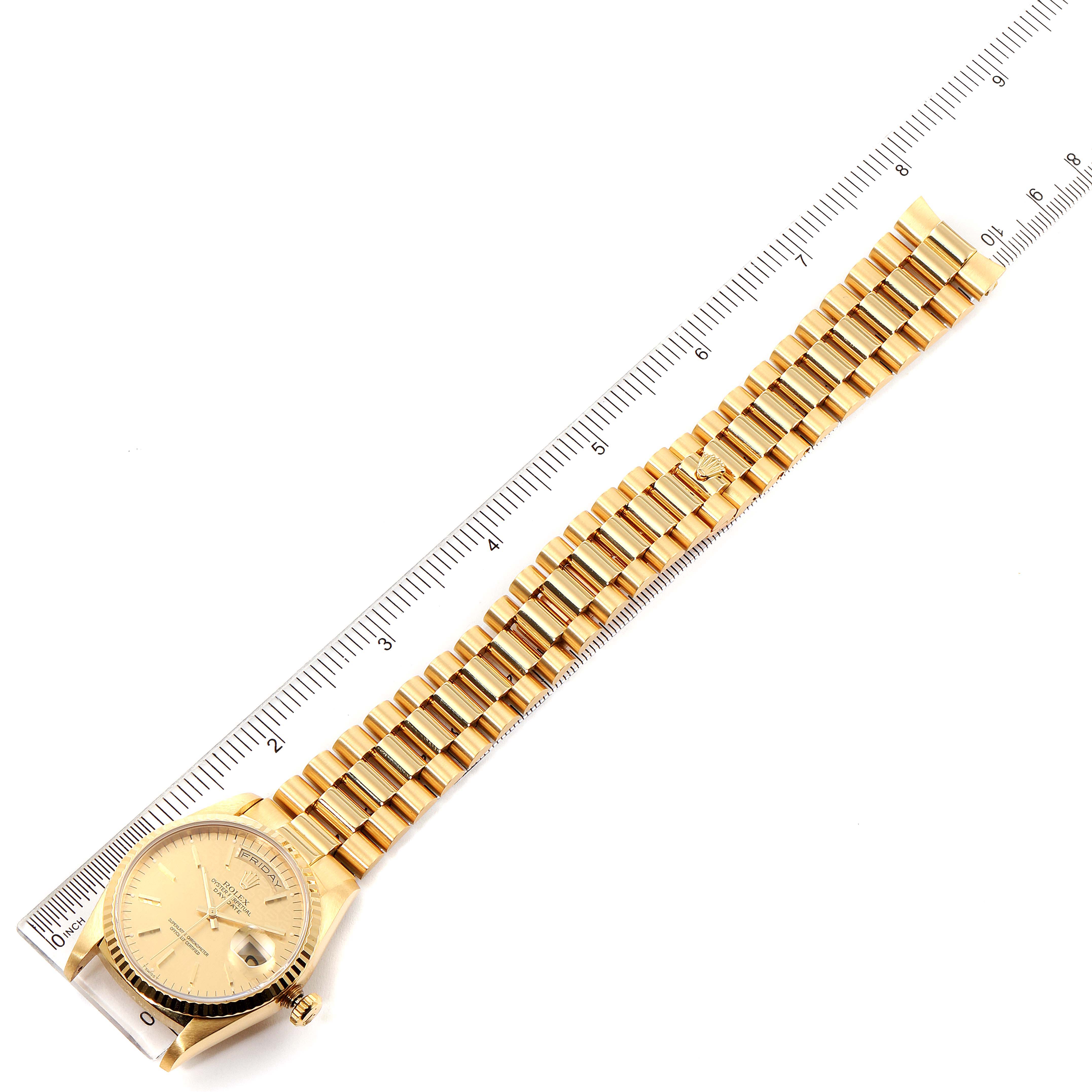 The image shows a Rolex President 18238 Men
s Yellow Gold Champagne Dial 18238 Men
s Yellow Gold Champagne Dial model watch laid flat, with the dial and full bracelet visible alongside a ruler for scale.
