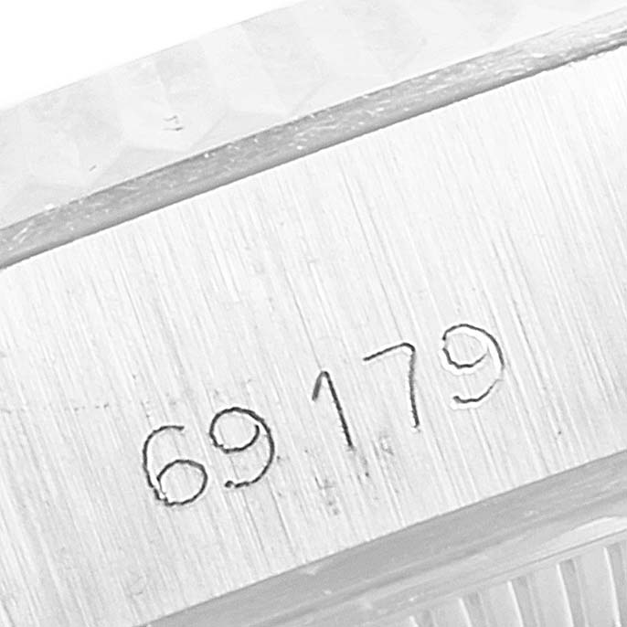 This image shows a close-up of the serial number engraved on the casing of the Rolex President 69179 Women's White Gold Silver Dial 69179 Women's White Gold Silver Dial model watch.
