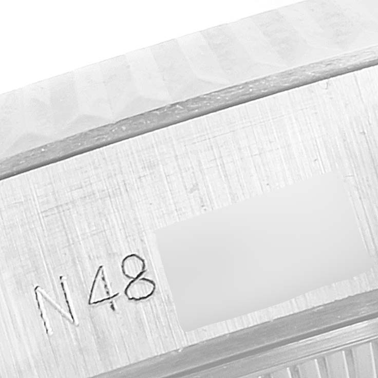 The image shows a close-up of the side of the Rolex President 69179 Women's White Gold Silver Dial 69179 Women's White Gold Silver Dial model watch, highlighting a part of its case with an engraved number.