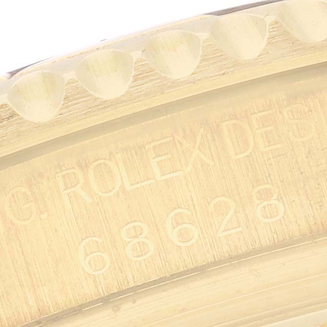 The image shows a close-up of the Yacht-Master's engraved side with the Rolex branding and model number.