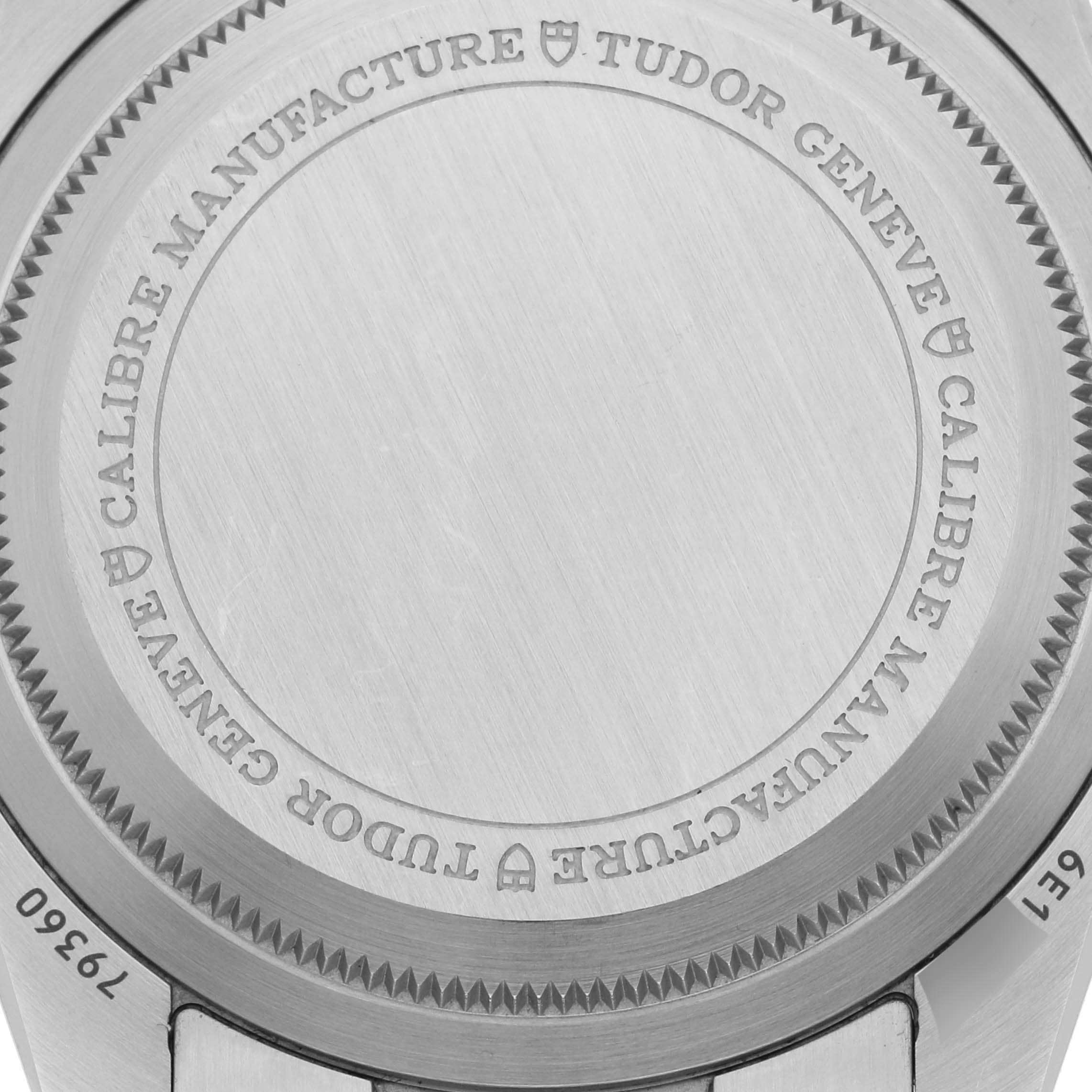 The image shows the back of the Tudor Heritage Chrono M79360N-002 Men's Stainless Steel Silver Dial M79360N-002 Men's Stainless Steel Silver Dial watch, displaying the engraved details and edge texture.
