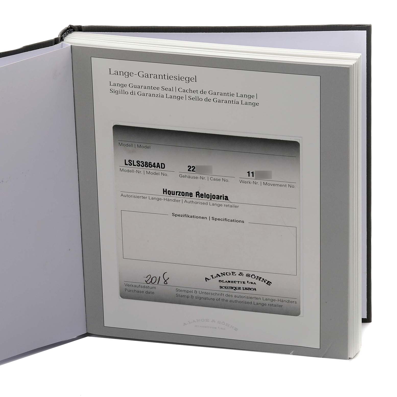 The image shows the Lange Garantie Seal booklet for an A. Lange & Sohne Saxonia 386.032 Men's Rose Gold Silver Dial watch at a slight angle.