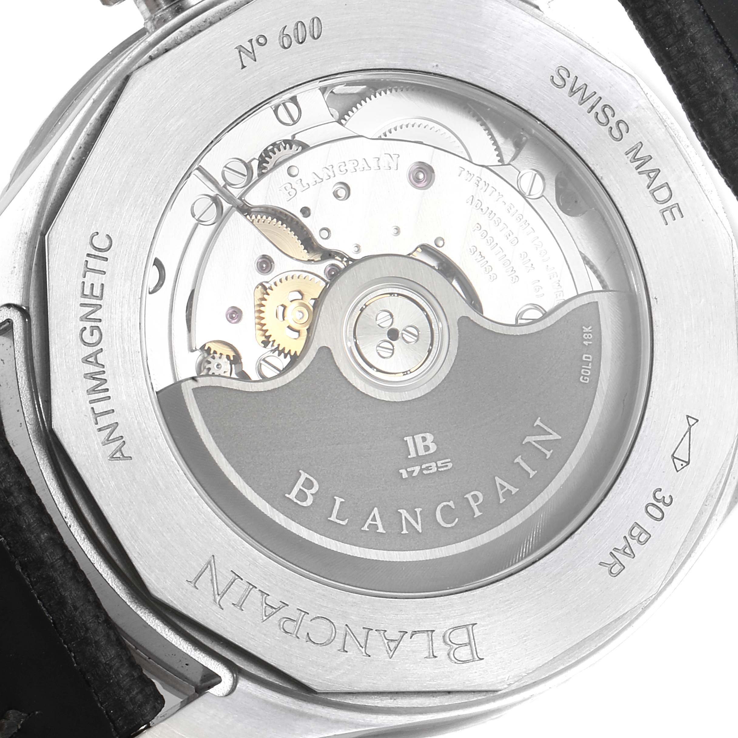 The image shows the back of the Blancpain Fifty Fathoms 5100B-1110-B52A Men's Stainless Steel Grey Dial 5100B-1110-B52A Men's Stainless Steel Grey Dial watch, highlighting its internal mechanical parts and engravings.