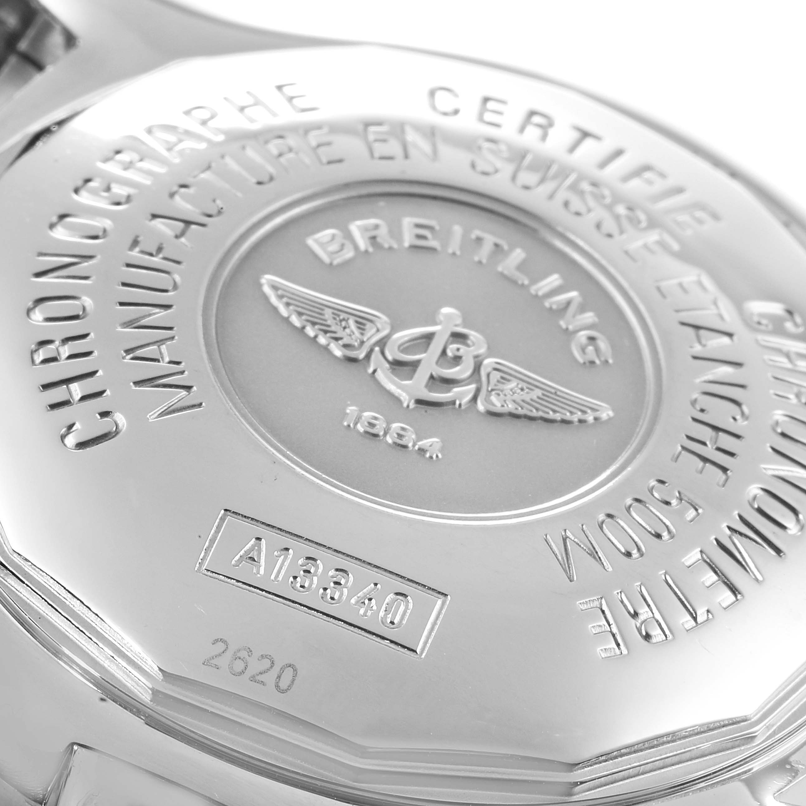 This close-up image shows the case back of a Breitling Superocean A13340 Men's Stainless Steel Beige Dial A13340 Men's Stainless Steel Beige Dial watch, displaying its engraved details.