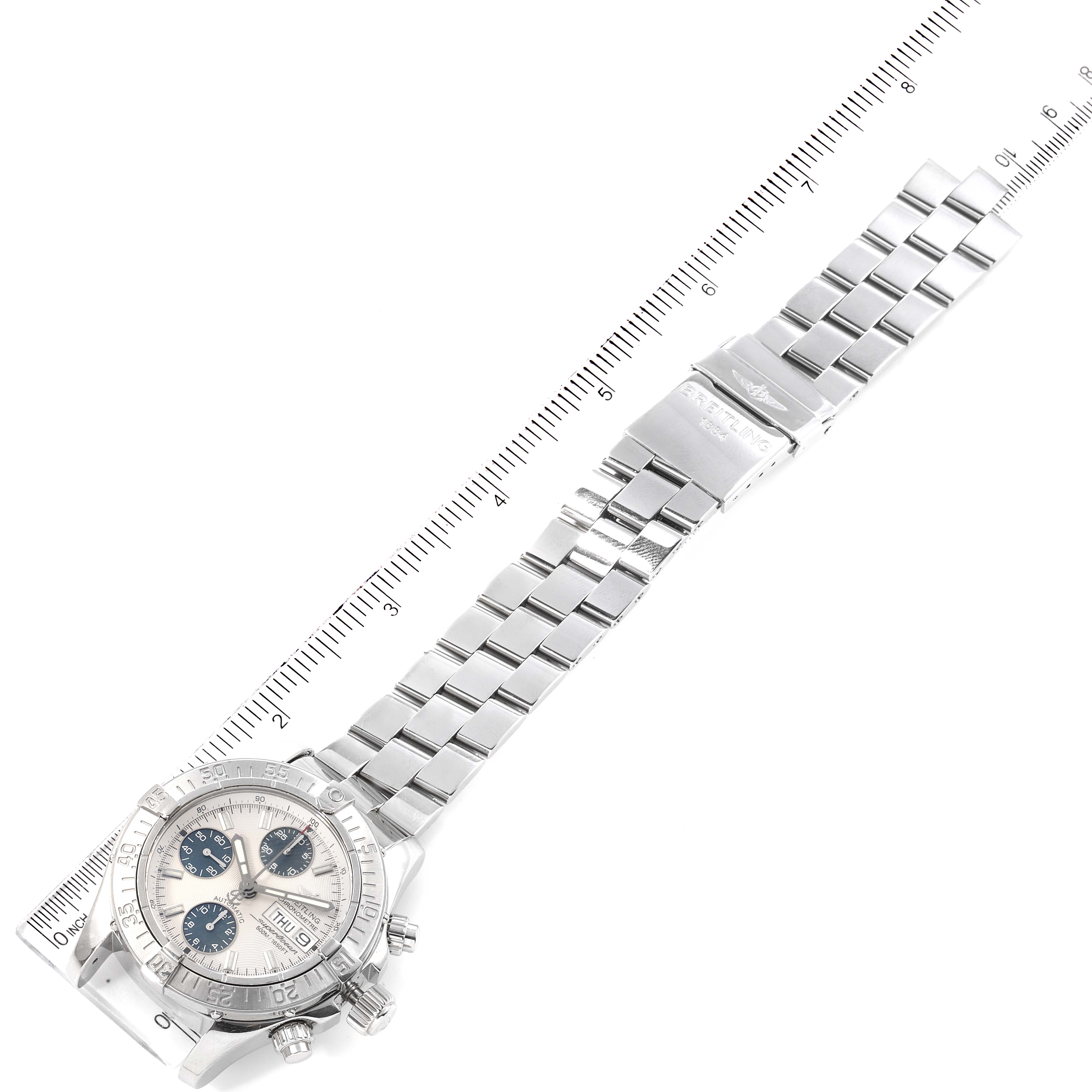 The image shows the front view of a Breitling Superocean A13340 Men's Stainless Steel Beige Dial A13340 Men's Stainless Steel Beige Dial watch with a ruler for scale, displaying the face, bezel, and metal bracelet.