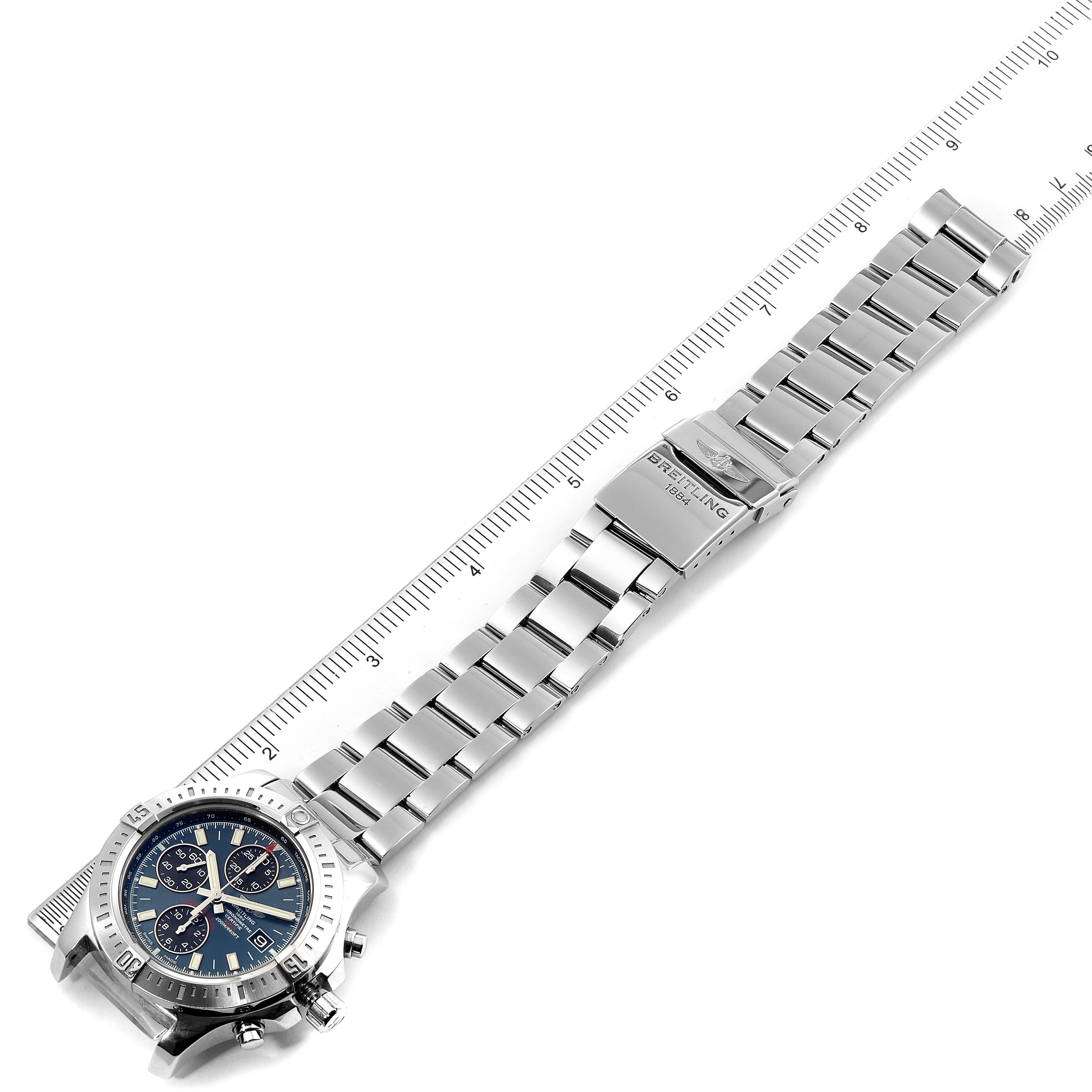 The image shows a Breitling Colt A13035 Men's Stainless Steel Blue Dial A13035 Men's Stainless Steel Blue Dial watch and its metal bracelet, laid flat next to a ruler for measurement.
