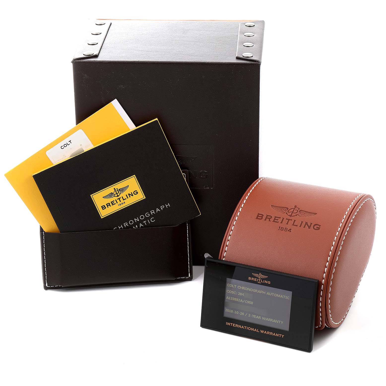 The image shows packaging, booklets, a leather case, and a warranty card for the Breitling Colt A13035 Men's Stainless Steel Blue Dial A13035 Men's Stainless Steel Blue Dial model watch.