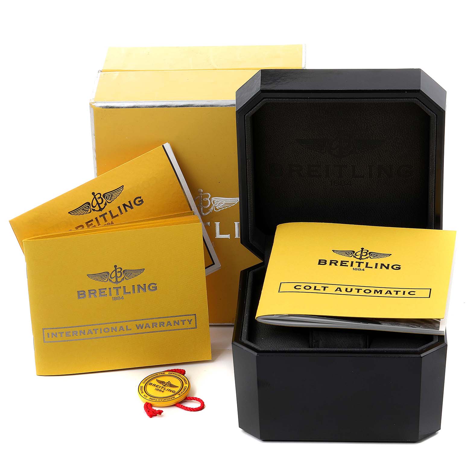 The image shows the packaging, warranty booklets, and manual for a Breitling Colt A17380 Men's Stainless Steel Blue Dial A17380 Men's Stainless Steel Blue Dial model watch.