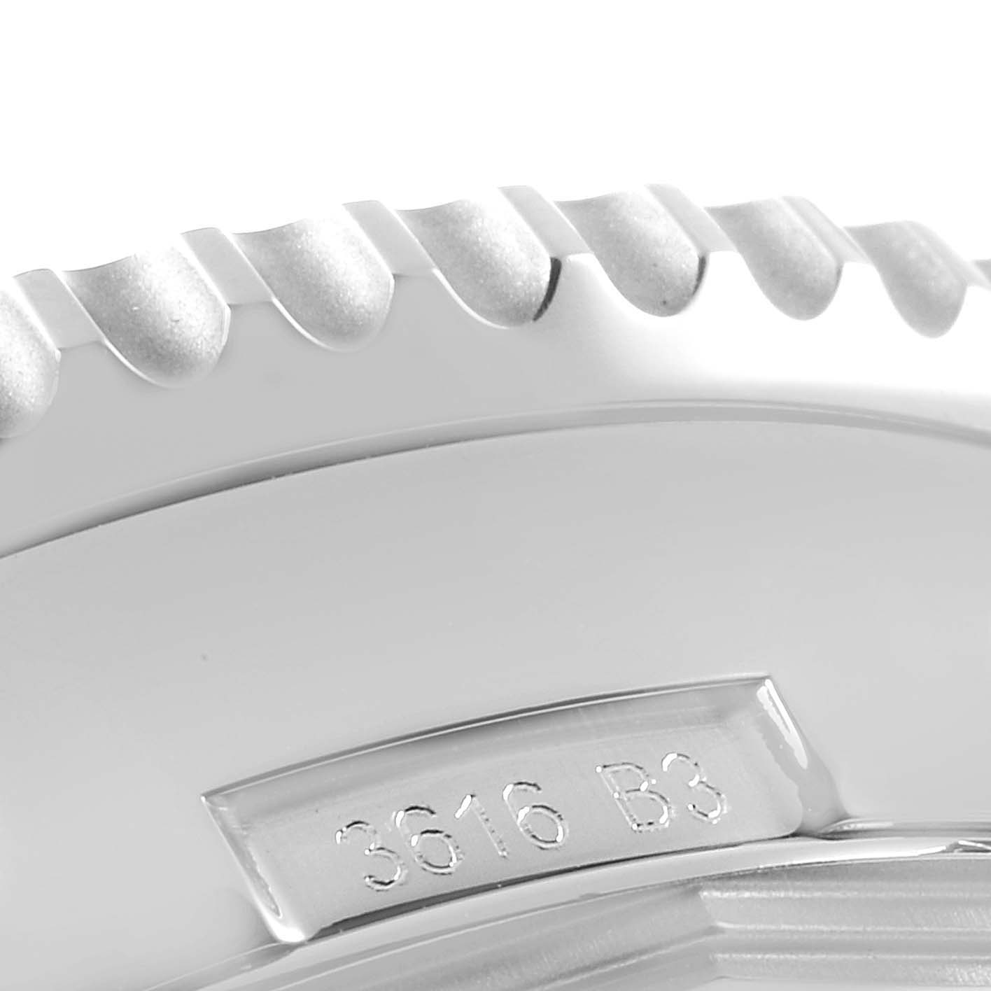 The image shows a close-up of the bezel and part of the case back of a Breitling Navitimer AB0127 Men's Stainless Steel Black Dial AB0127 Men's Stainless Steel Black Dial watch, focusing on the engraved reference number.