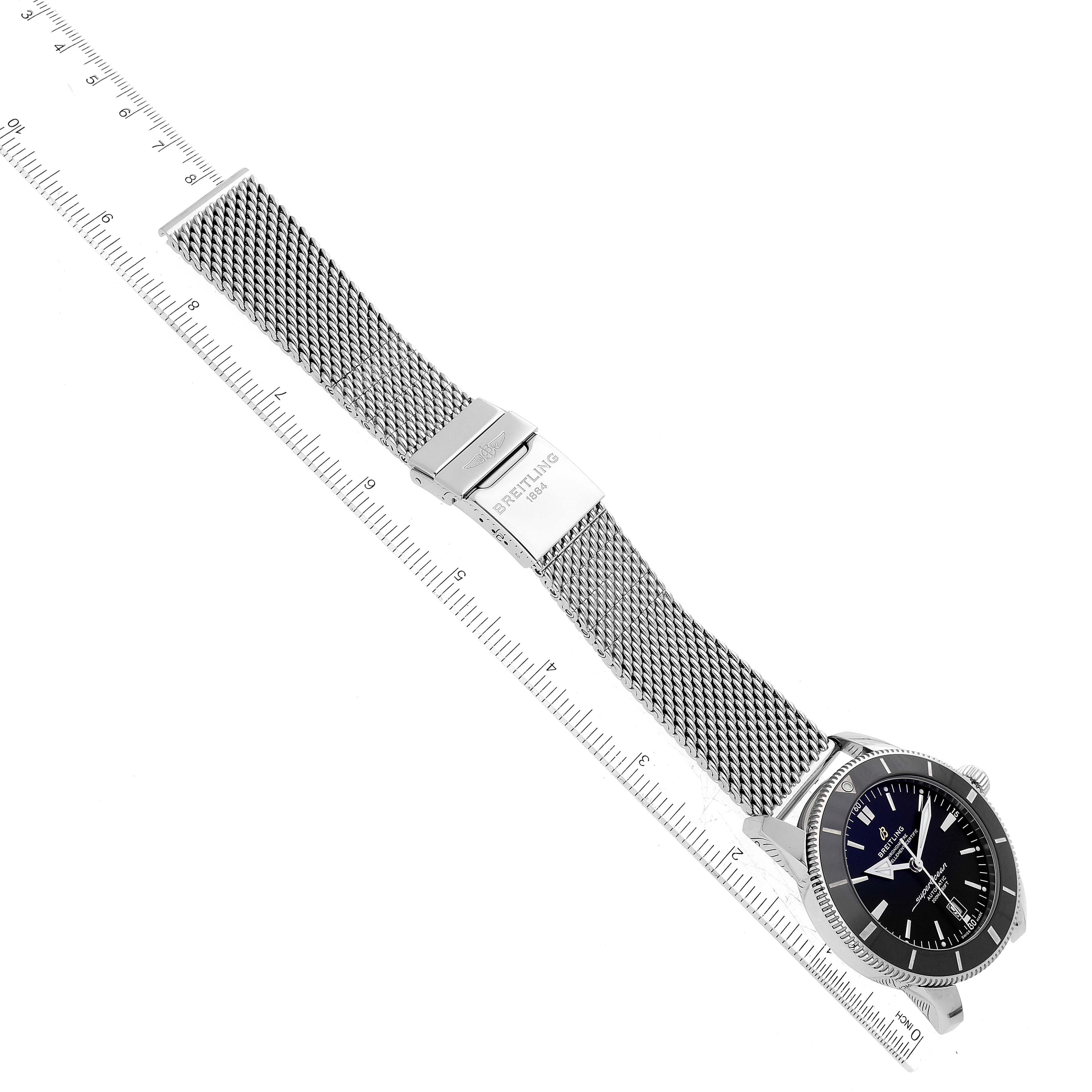 The image shows a Breitling Superocean AB2020 Men's Stainless Steel Black Dial AB2020 Men's Stainless Steel Black Dial watch laying flat with its mesh bracelet fully extended and a clasp visible.