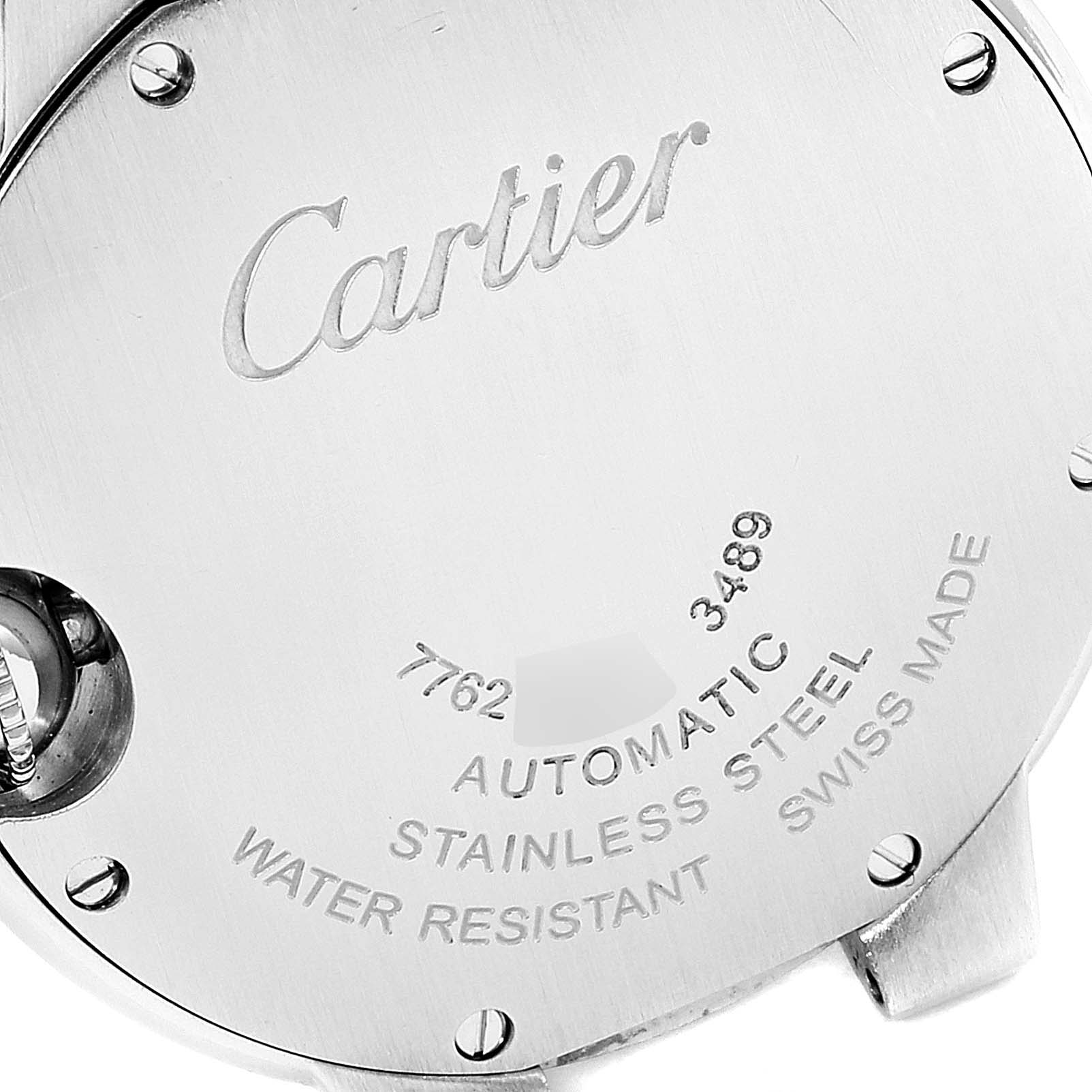 This image shows the back case of a Cartier Ballon Bleu WE902074 Women
s Stainless Steel Silver Dial WE902074 Women
s Stainless Steel Silver Dial watch, featuring engraved details and screws.