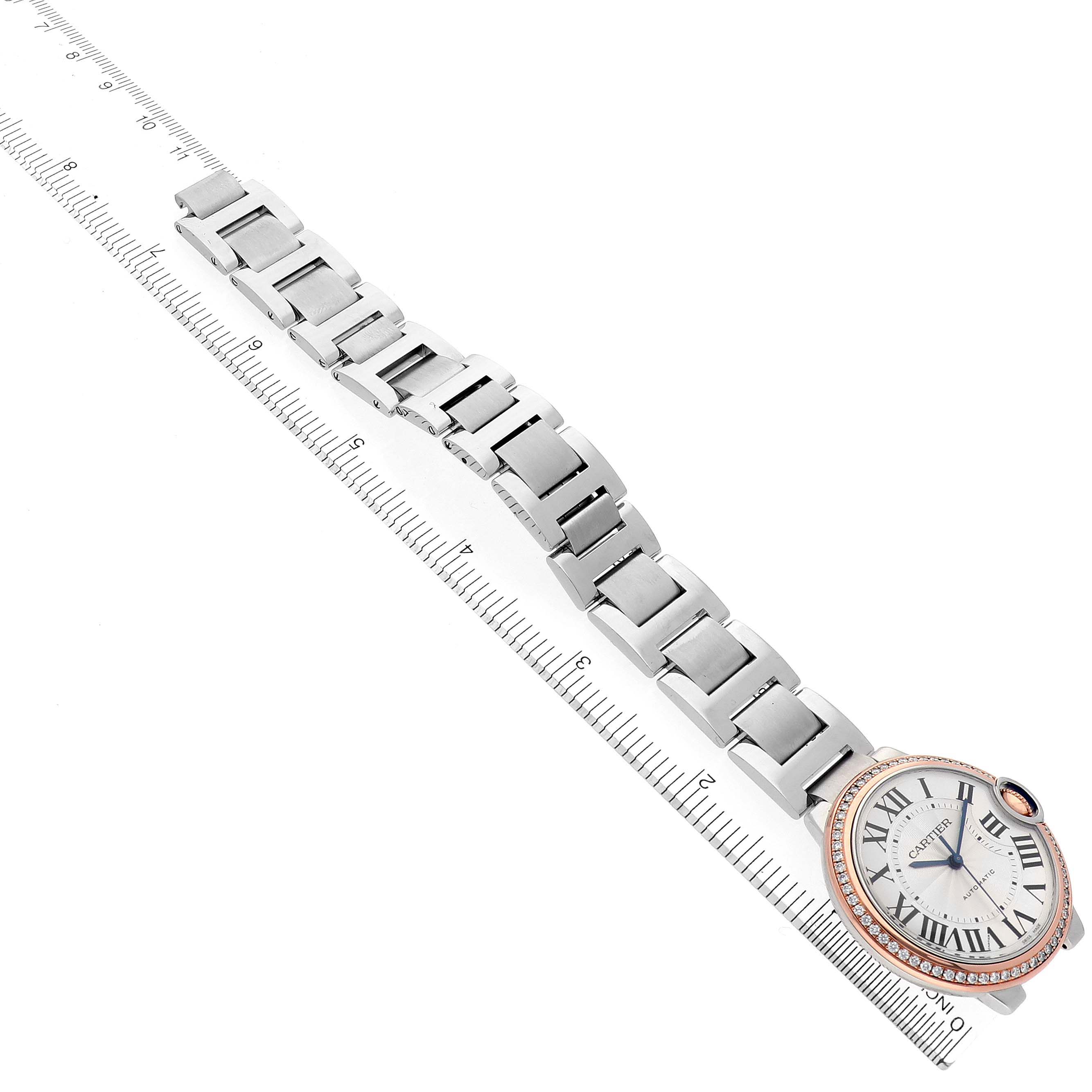 The Cartier Ballon Bleu WE902081 Women's Steel and Gold (two tone) Silver Dial WE902081 Women's Steel and Gold (two tone) Silver Dial watch is shown at a top-down angle, highlighting the face and entire bracelet.