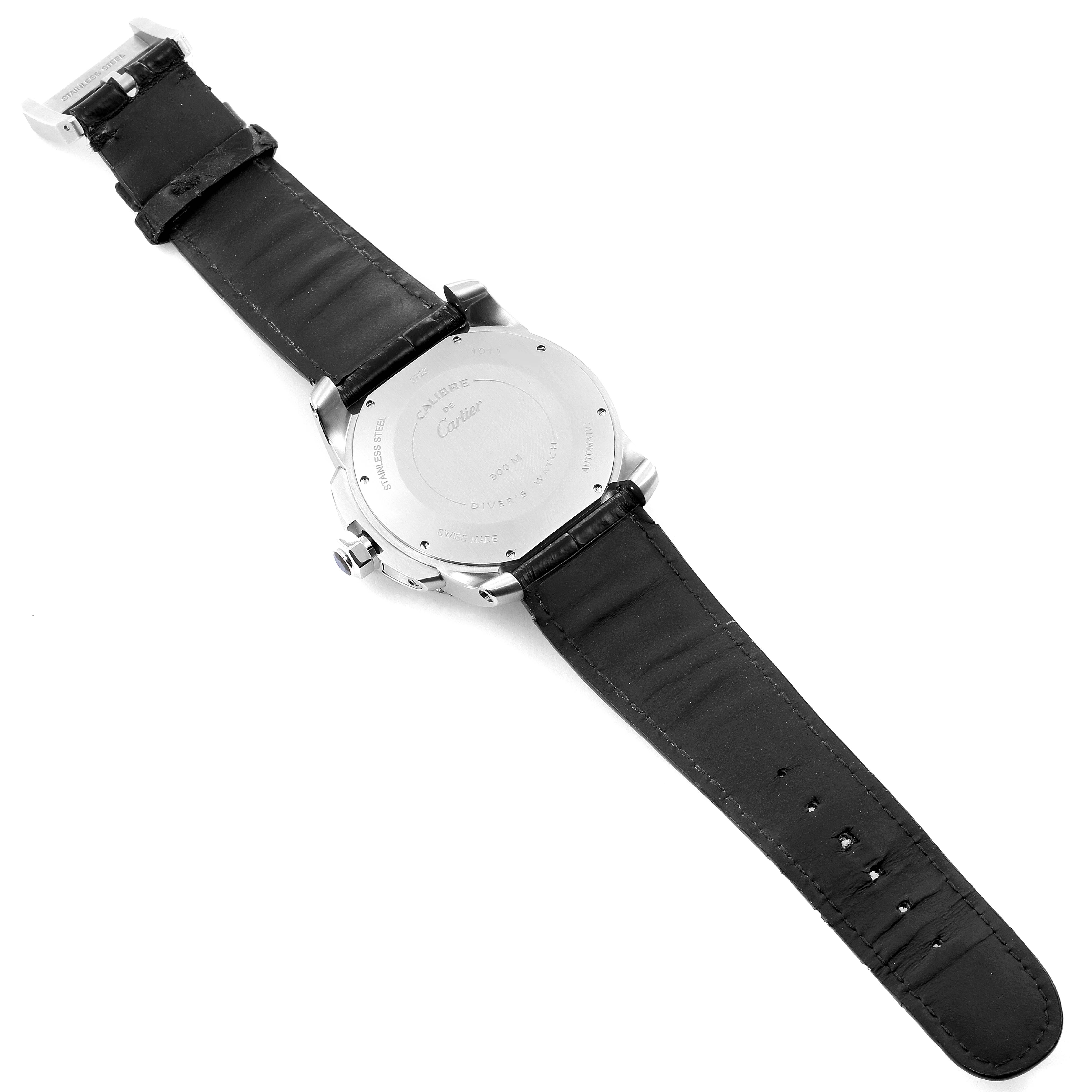 The image shows the back view of a Calibre de Cartier watch by Cartier, displaying its case back and black leather strap.