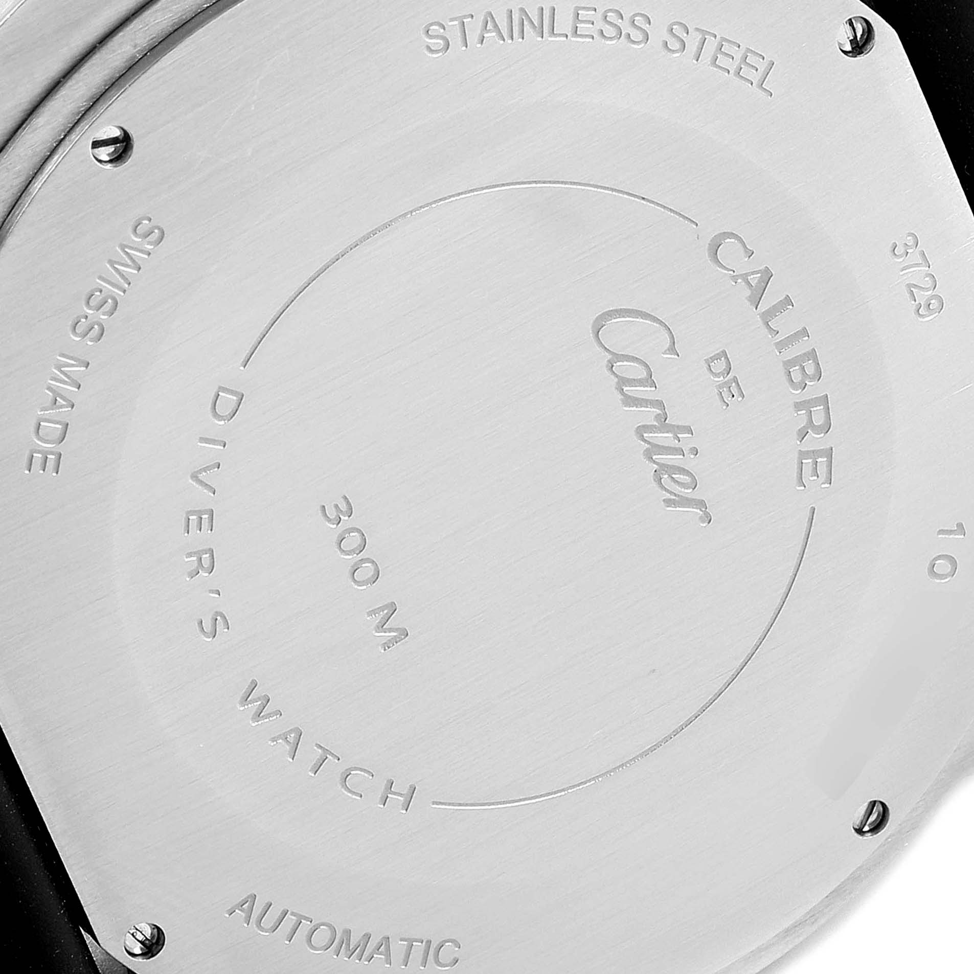The image shows the case back of a Calibre de Cartier diver's watch by Cartier, highlighting details like "STAINLESS STEEL," "300 M," and "AUTOMATIC."