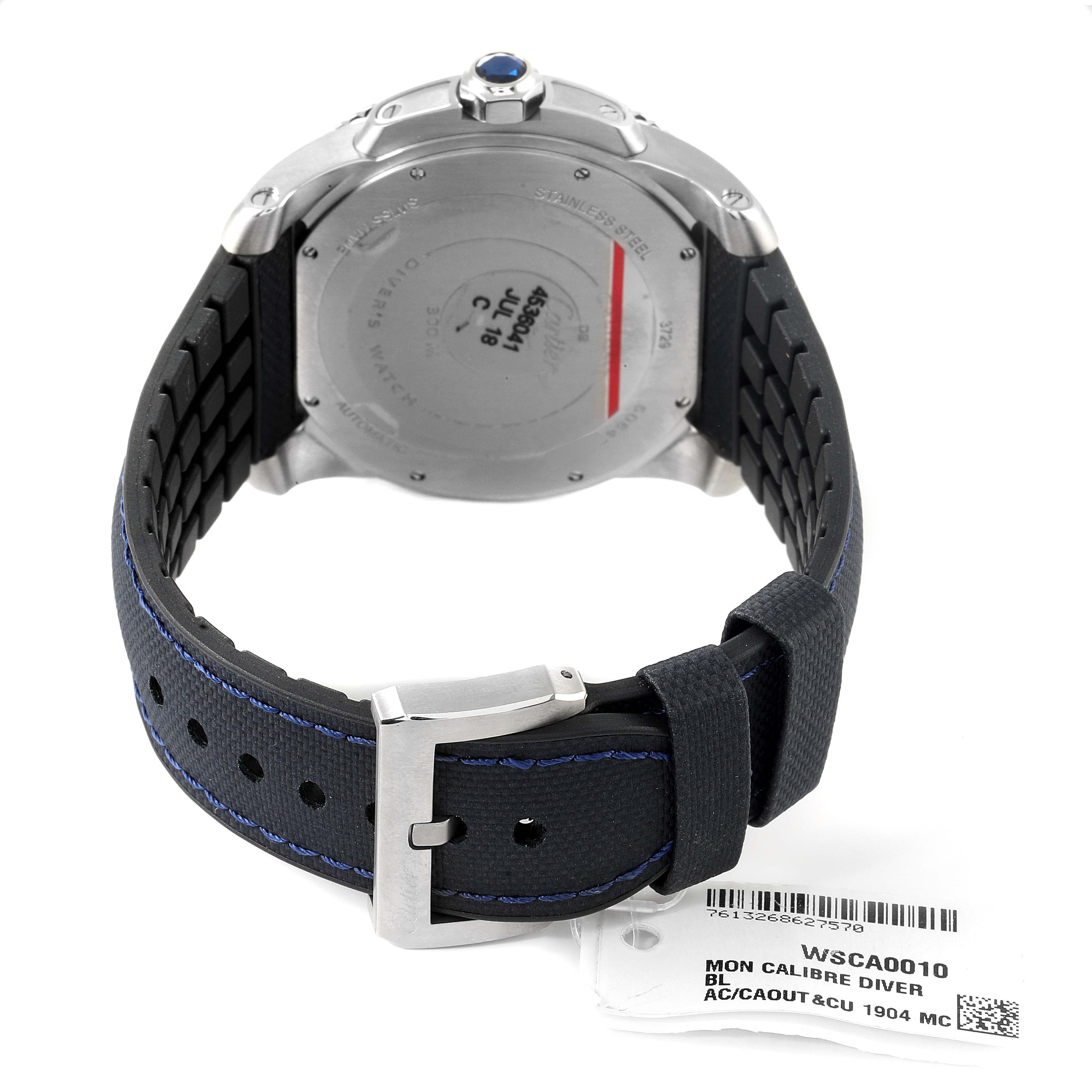 The image shows the back and strap of a Calibre de Cartier Diver model watch by Cartier, including the clasp and tag.