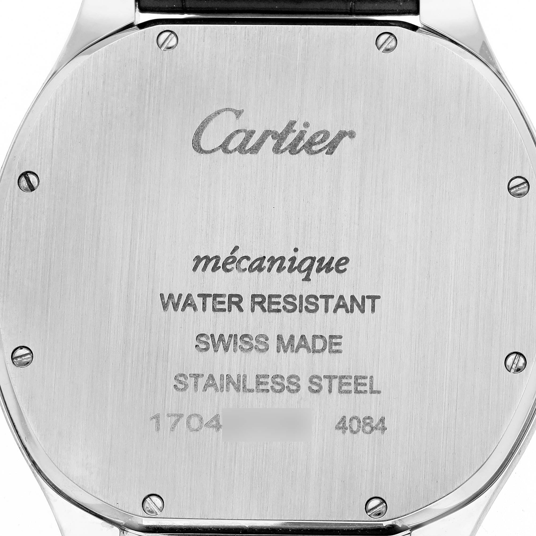 The image shows the back of a Drive de Cartier watch by Cartier, featuring engravings and screws on the stainless steel casing.