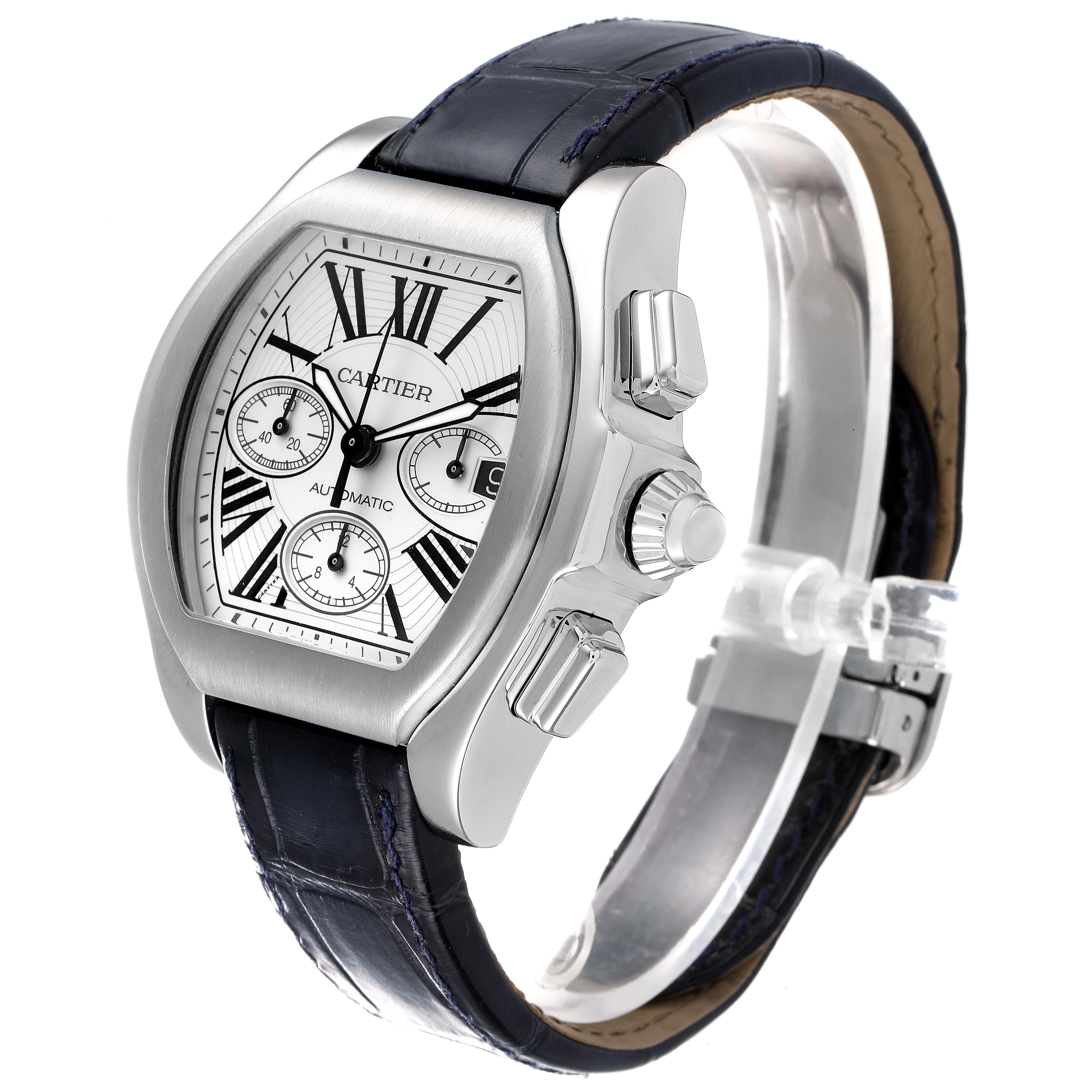 The image shows a Cartier Roadster W6206019 Men
s Stainless Steel Silver Dial W6206019 Men
s Stainless Steel Silver Dial watch at a three-quarter angle, highlighting its silver case, black leather strap, and chronograph dials.