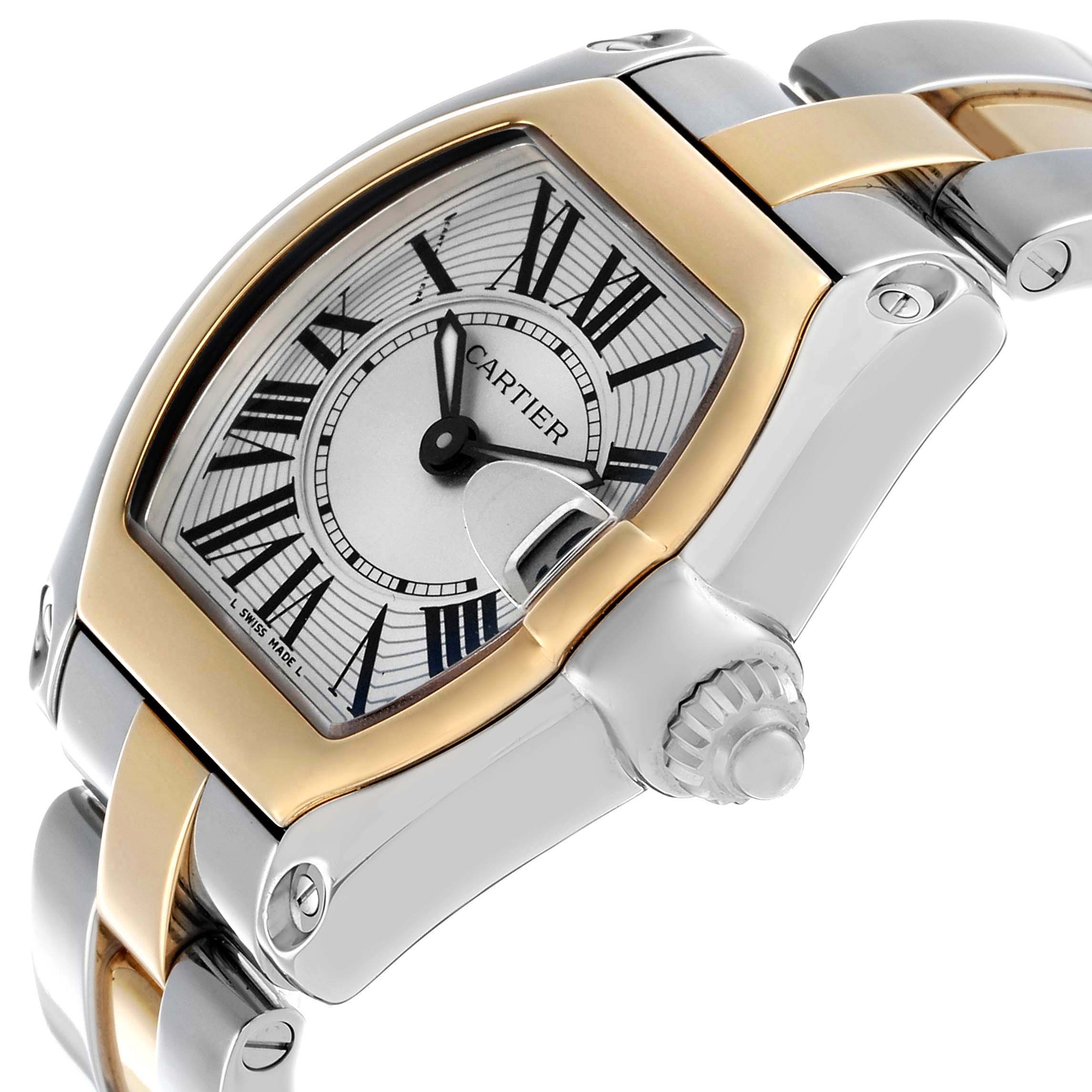 The Cartier Roadster W62026Y4 Women's Steel and Gold (two tone) Silver Dial watch is shown from an angled side view, highlighting the dial, crown, and bracelet connection.