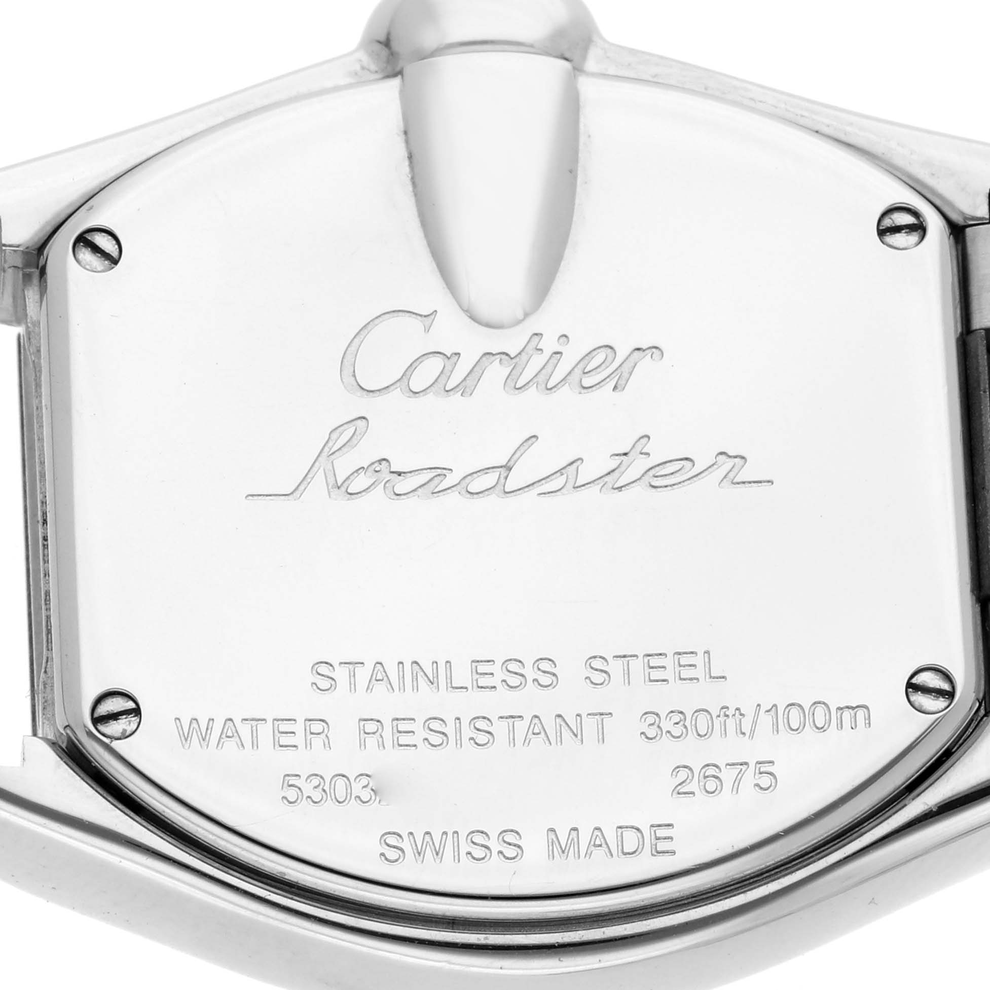 The image shows the back case of a Cartier Roadster W62026Y4 Women's Steel and Gold (two tone) Silver Dial watch, featuring engravings of the brand, model, and specifications.