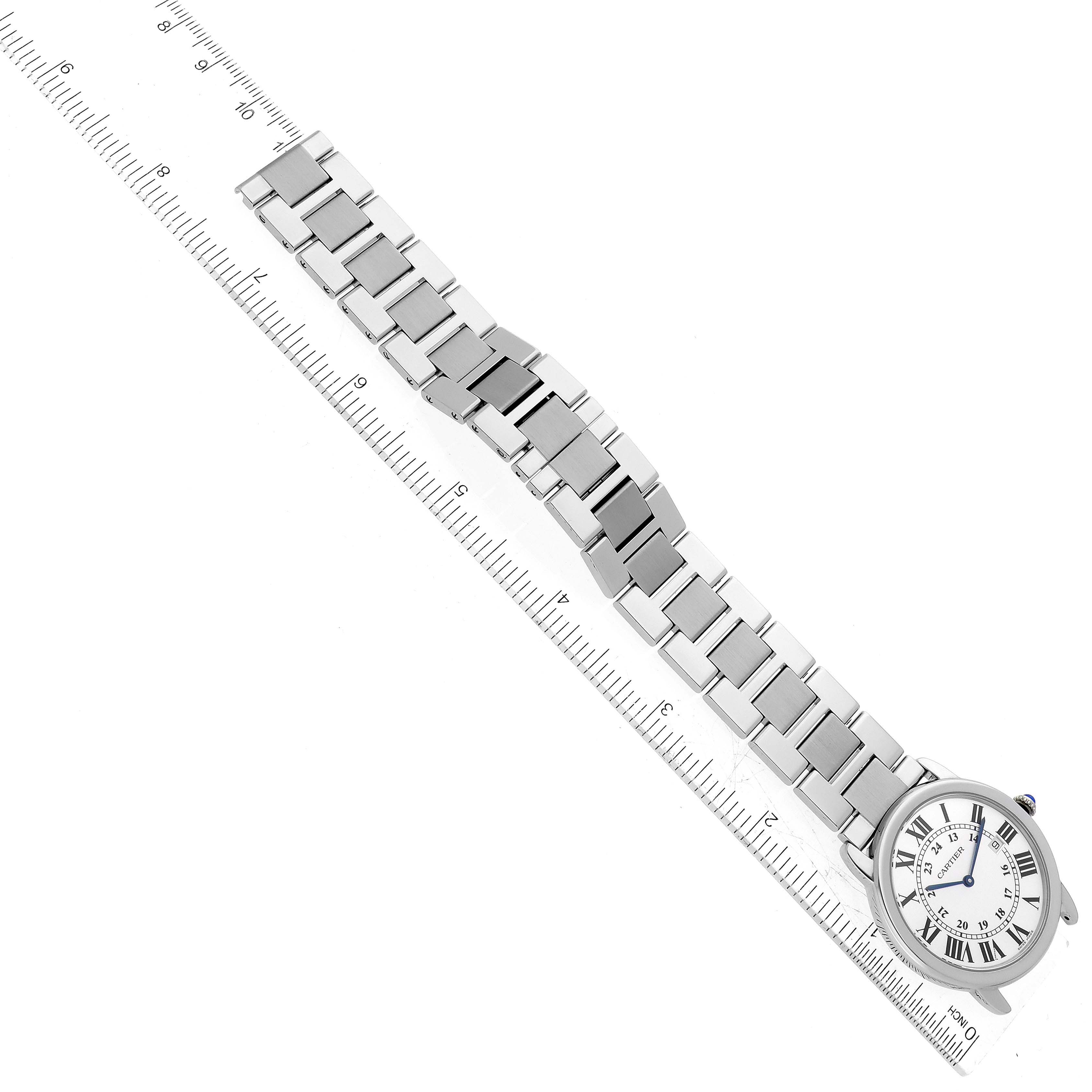 The image shows the full view of a Cartier Ronde W6701005 Men
s Stainless Steel Silver Dial W6701005 Men
s Stainless Steel Silver Dial watch laid next to a ruler for size reference.