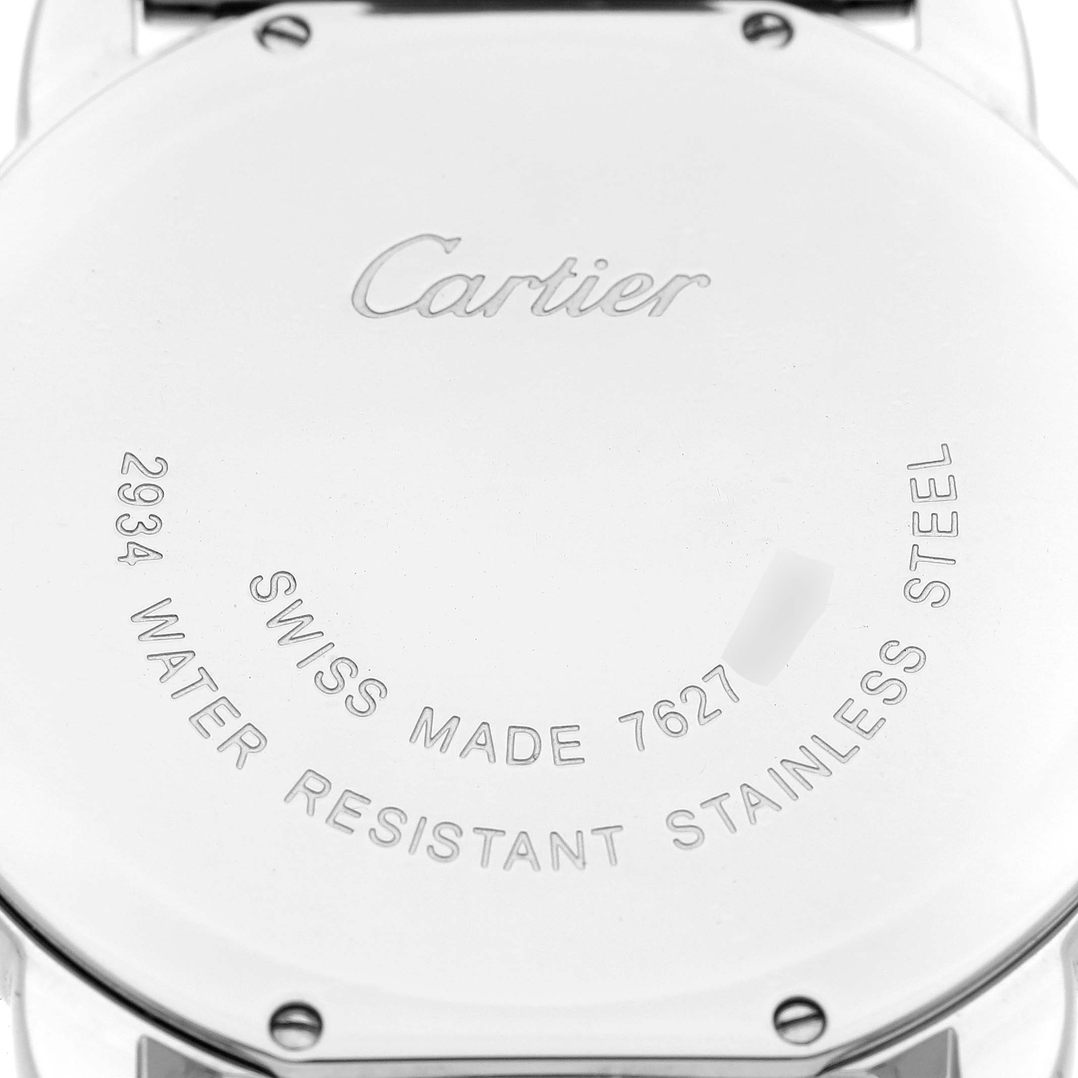 The image shows the back case of the Ronde model by Cartier, displaying engraving details and screws.