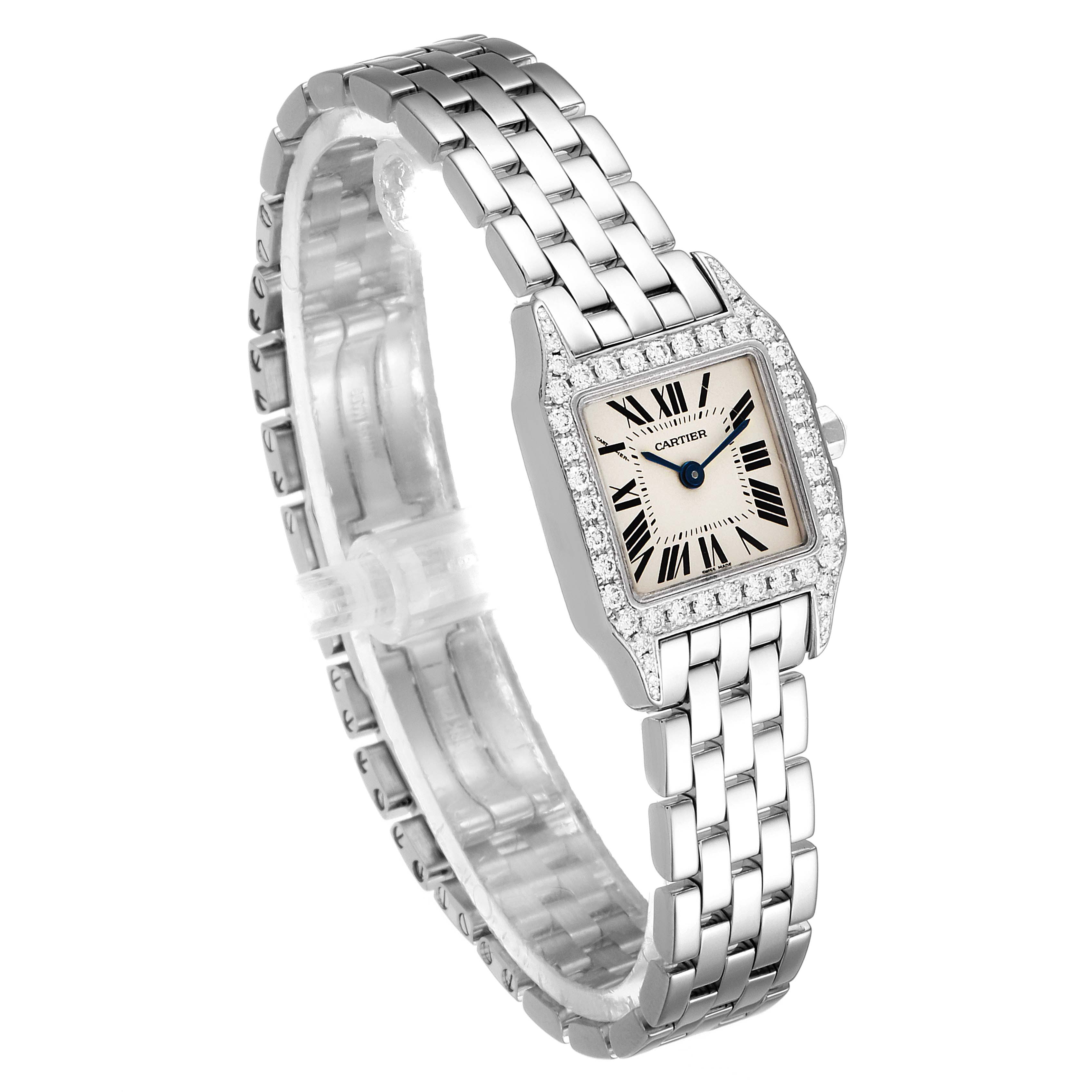 This image shows a Cartier Santos Demoiselle WF9005Y8 Women's White Gold Silver Dial WF9005Y8 Women's White Gold Silver Dial watch at a slight angle, highlighting its face, bezel, and bracelet.