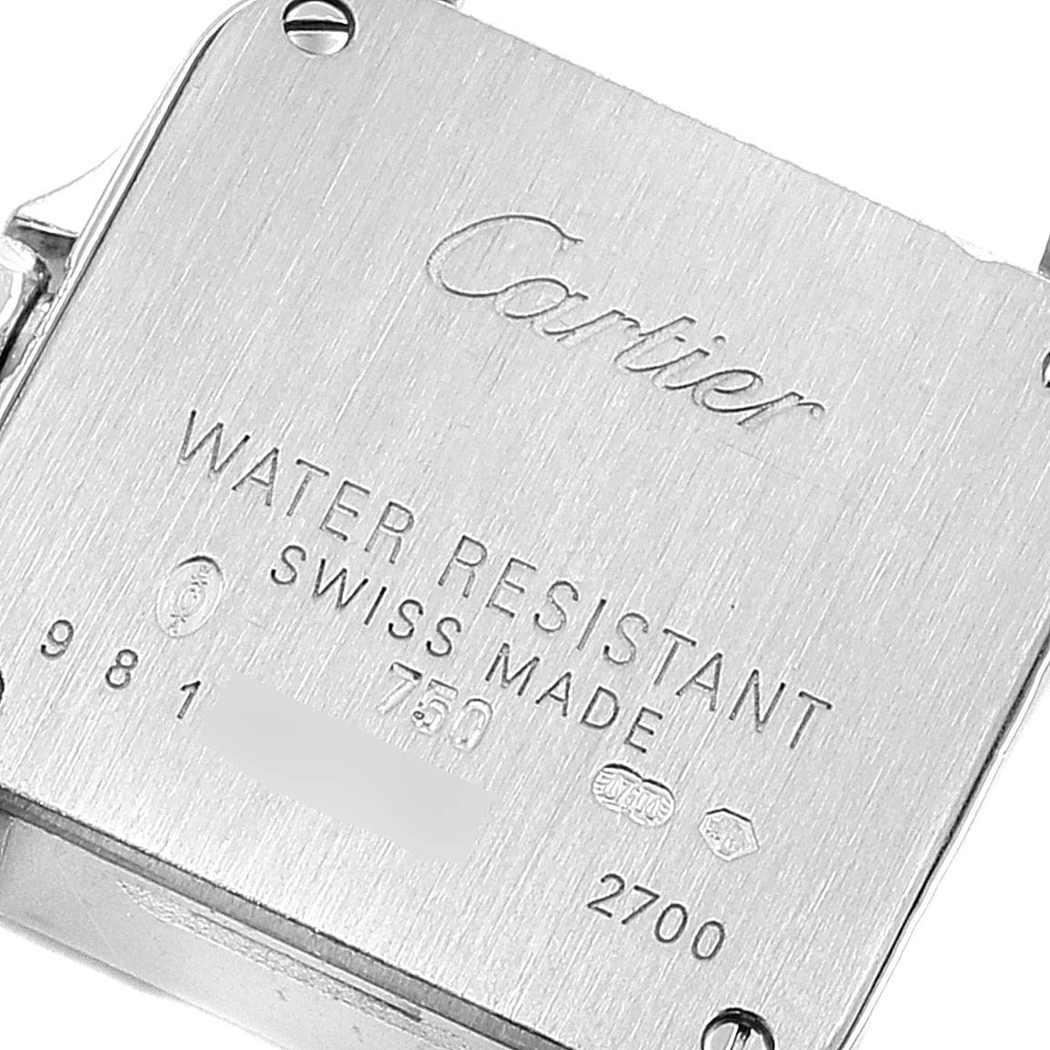 This image shows the back case of a Cartier Santos Demoiselle WF9005Y8 Women's White Gold Silver Dial WF9005Y8 Women's White Gold Silver Dial watch, highlighting engraving details and screw placements.