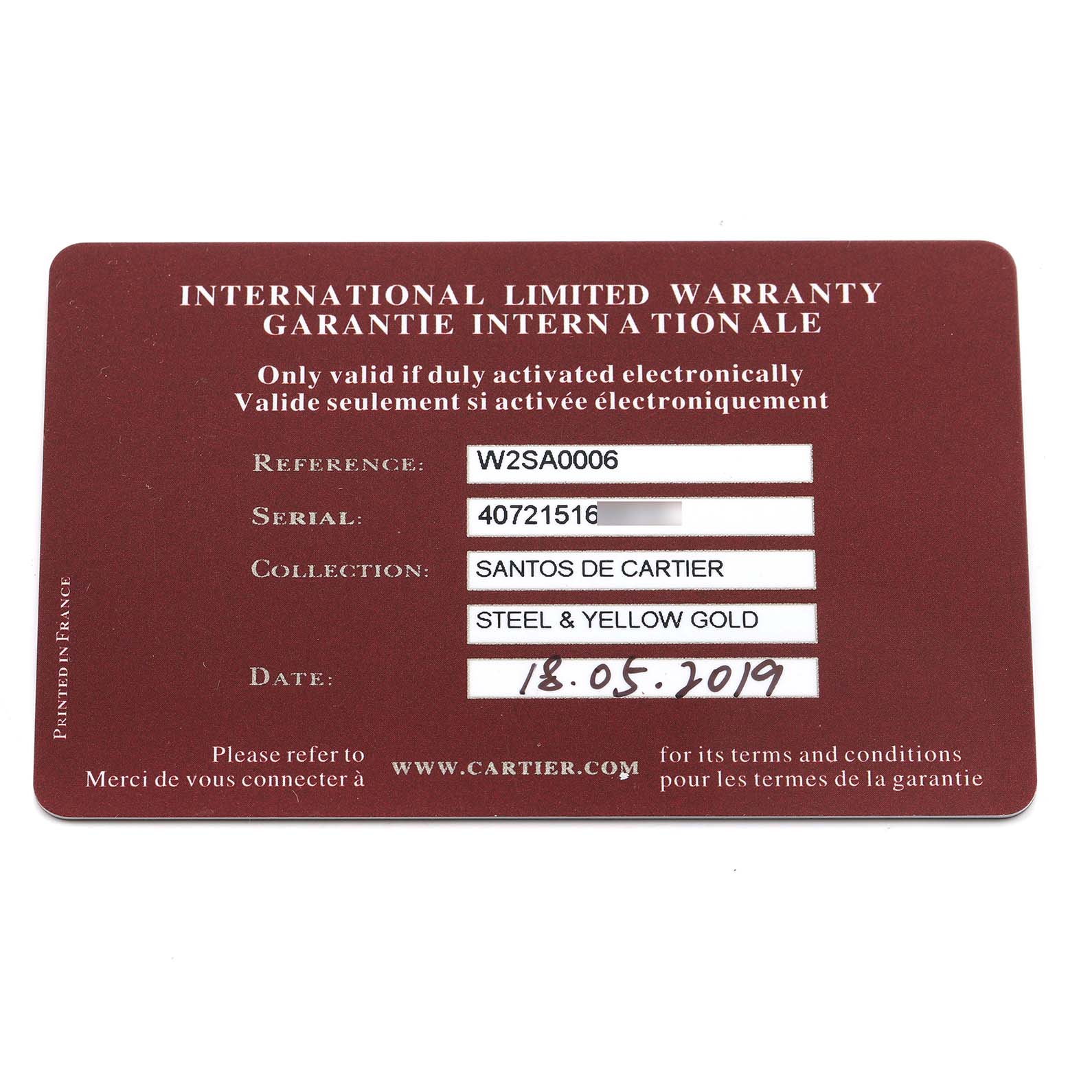 The image shows the international limited warranty card for the Santos de Cartier watch model.