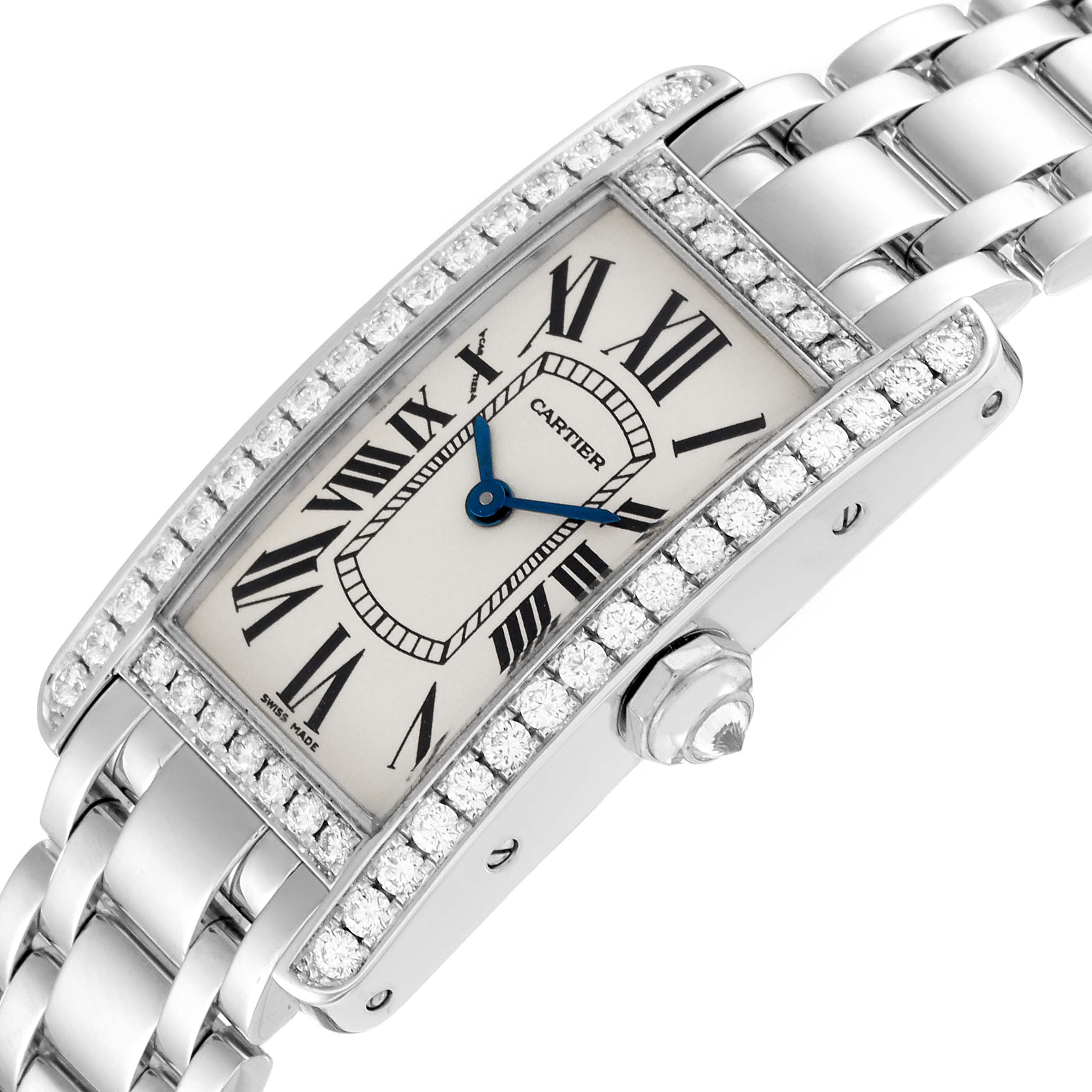 This image shows the dial, bezel, crown, and part of the bracelet of the Cartier Tank Americaine WB7073L1 Women's White Gold Silver Dial WB7073L1 Women's White Gold Silver Dial watch at a tilted angle.