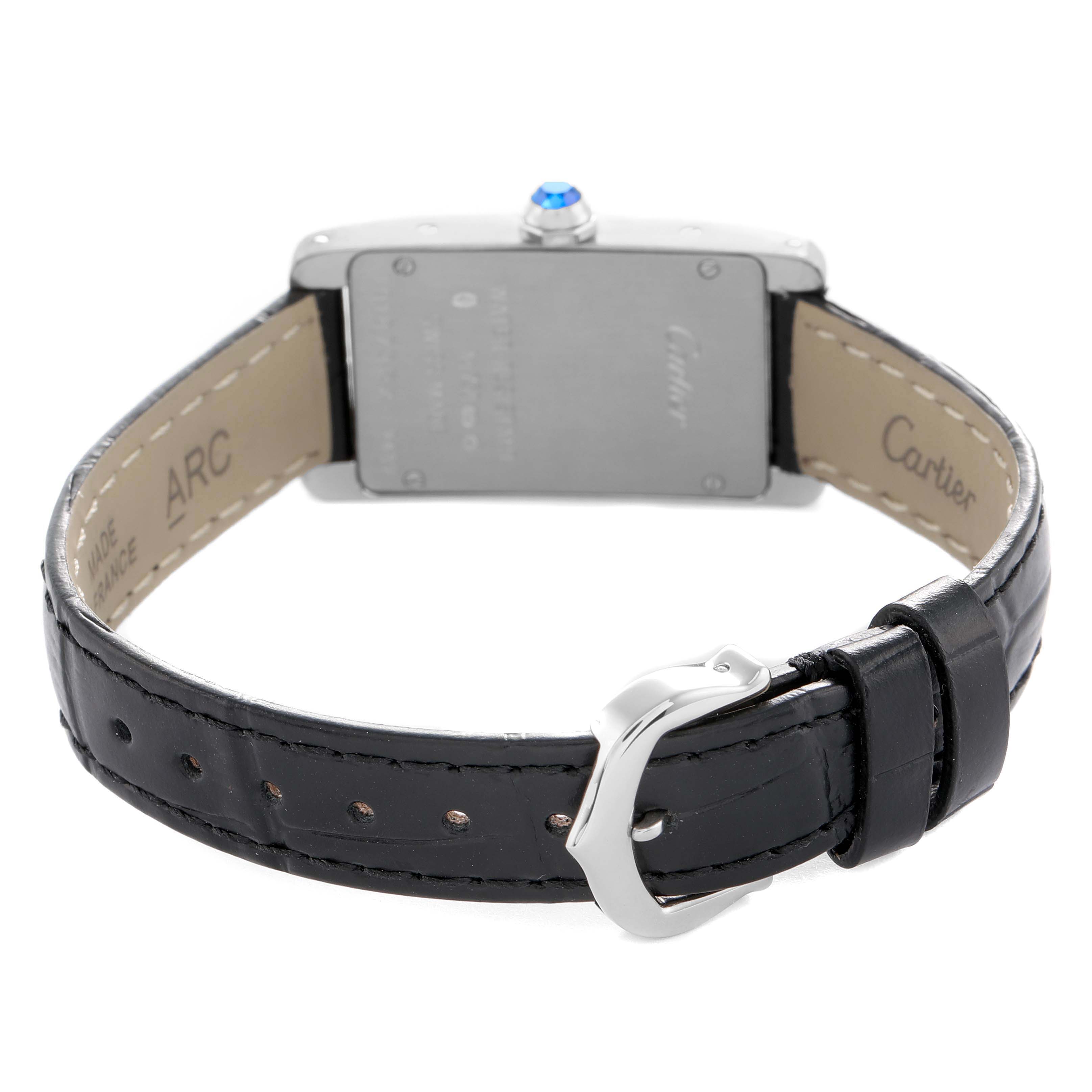 The Cartier Tank Americaine W2601956 Women's White Gold Silver Dial watch is shown from a rear angle, displaying the back case, crown, and leather strap with buckle.