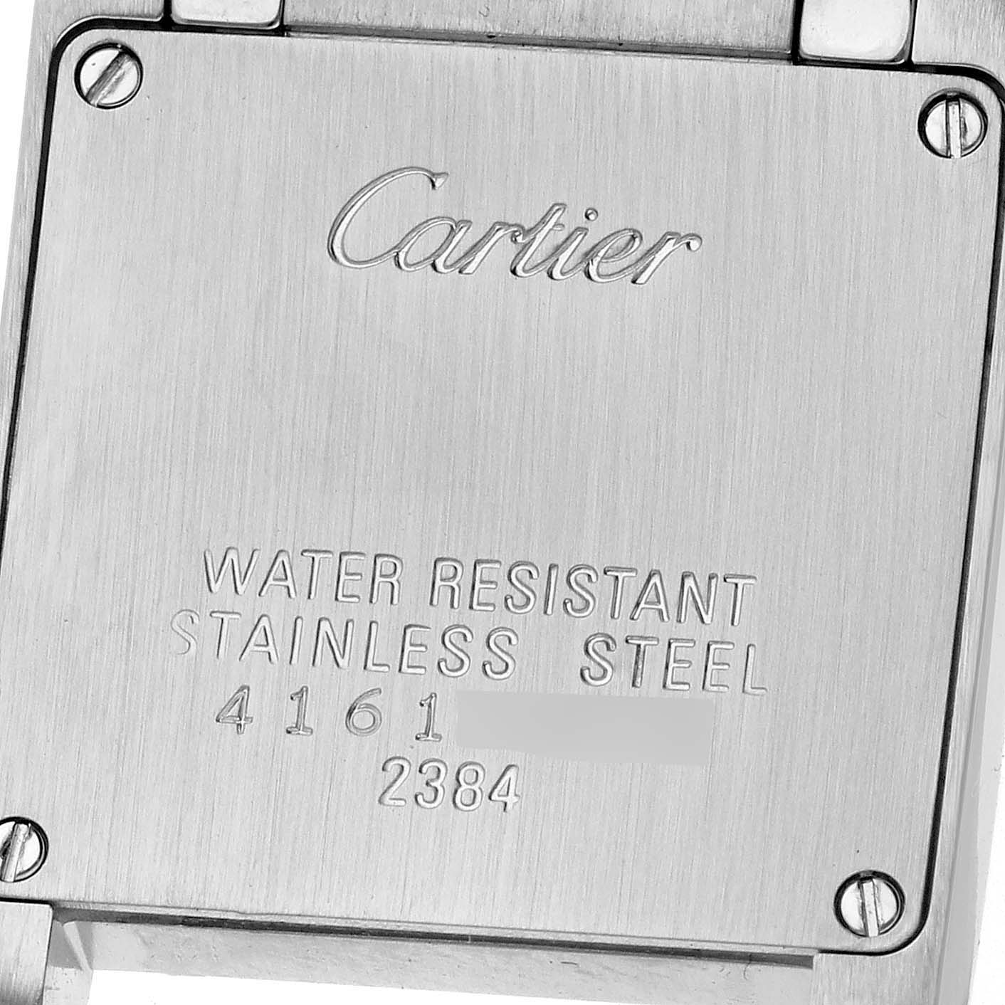 The image shows the back of a Cartier Tank Francaise W51007Q4 Women's Steel and Gold (two tone) Silver Dial W51007Q4 Women's Steel and Gold (two tone) Silver Dial watch, highlighting its engravings and screws.