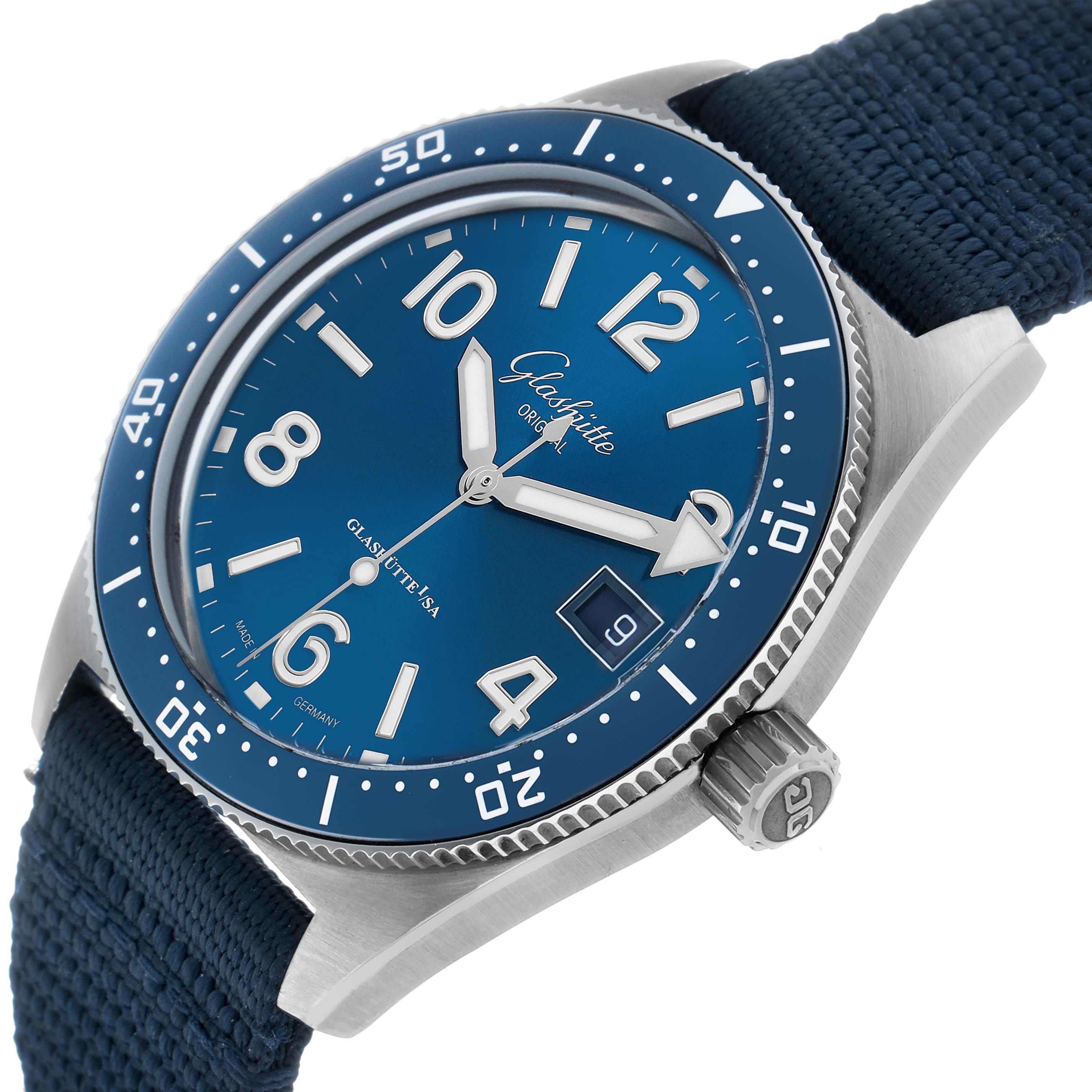 The Glashütte Original watch is shown at a slight angle, highlighting the blue dial, bezel, crown, and strap.