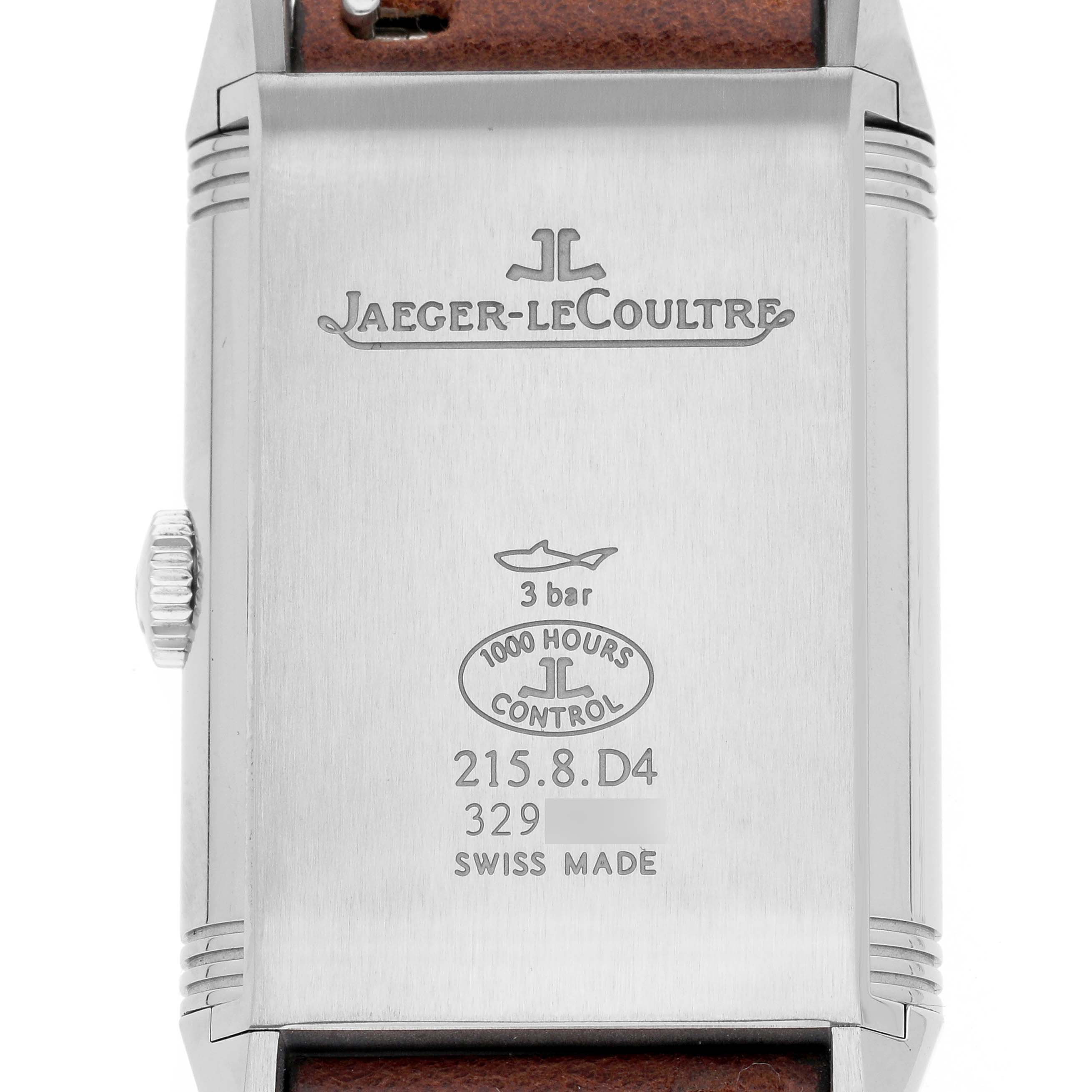 The Jaeger-LeCoultre Reverso watch is shown from the back, displaying the brand logo, model details, and strap connection.