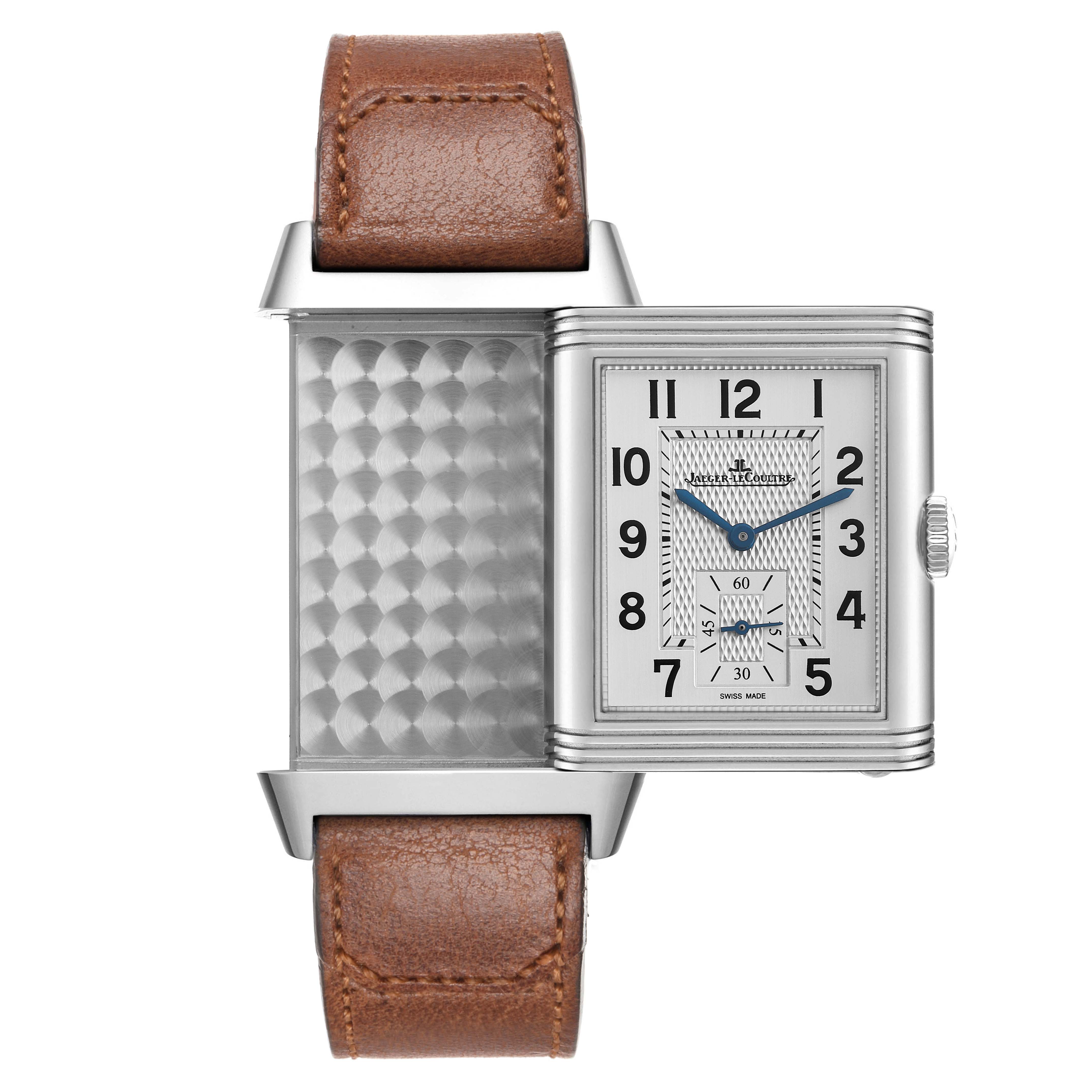 The Jaeger LeCoultre Reverso Q3848422 Men's Stainless Steel Silver Dial watch is shown from the front, partially open, revealing its dial and engraved back.