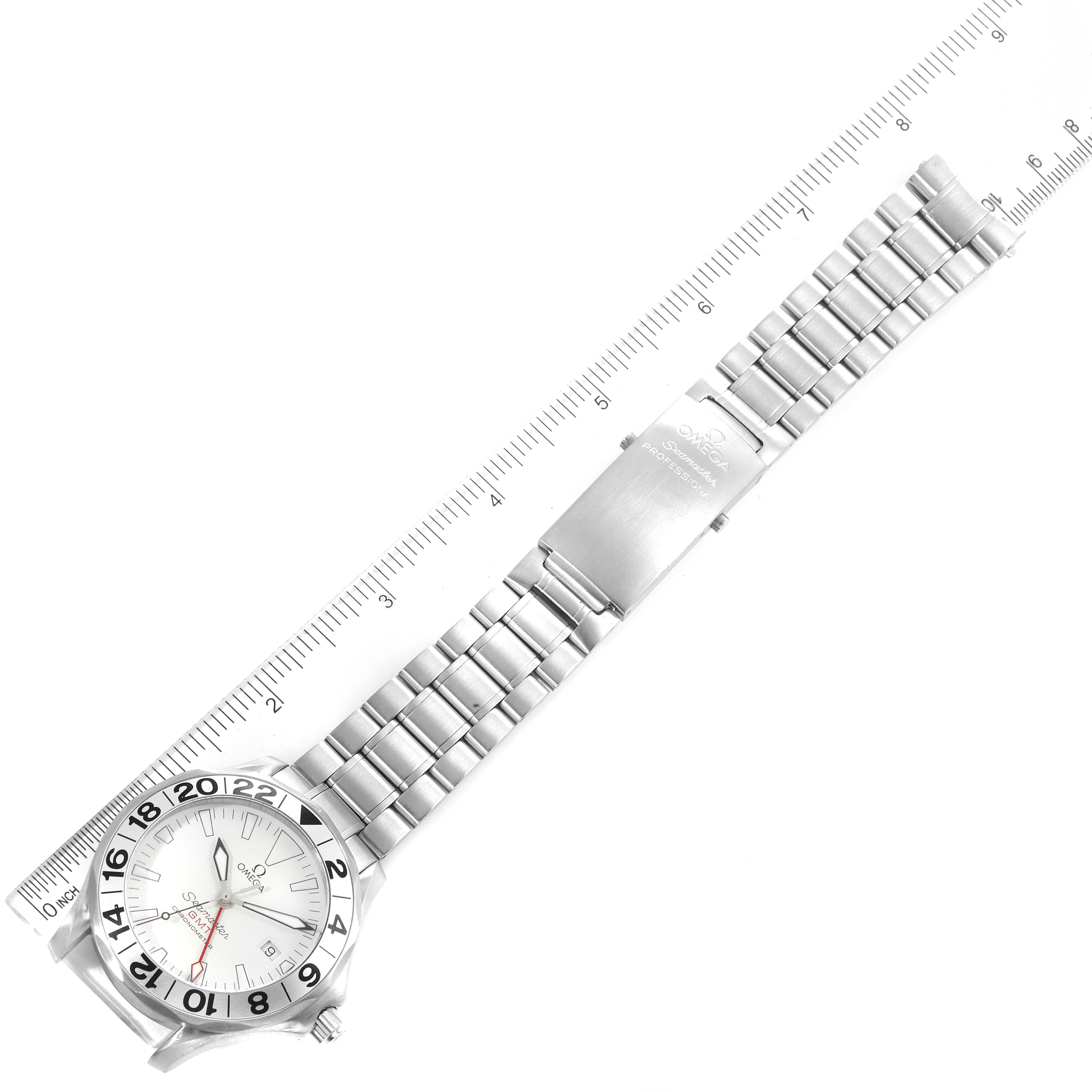 The image shows an Omega Seamaster 2538.20.00 Men's Stainless Steel White Dial 2538.20.00 Men's Stainless Steel White Dial watch from a top-down angle, including its face, band, and clasp, with a ruler for scale.