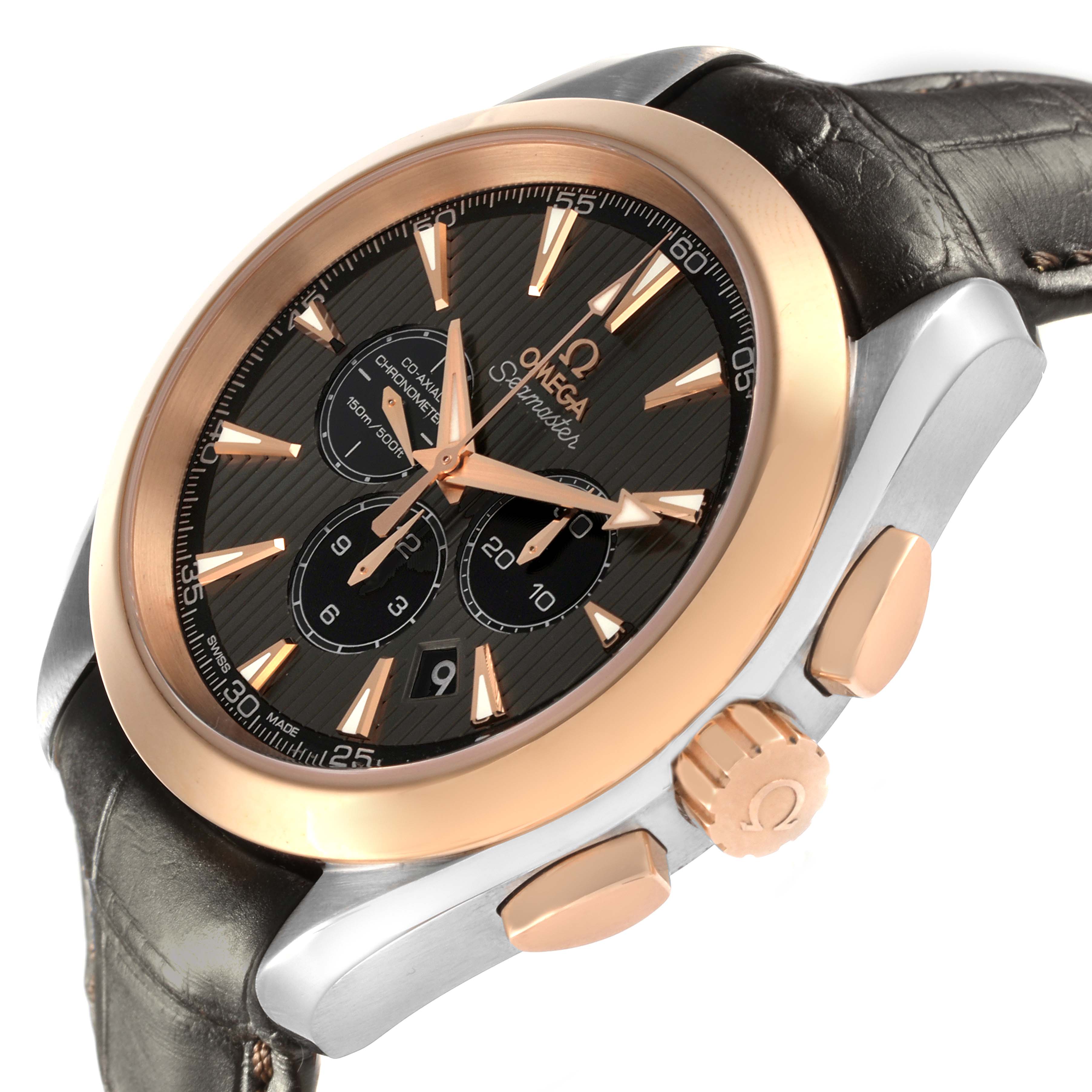 The Omega Aqua Terra 231.23.44.50.06.001 Men's Steel and Gold (two tone) Grey Dial 231.23.44.50.06.001 Men's Steel and Gold (two tone) Grey Dial watch is angled to show the face, crown, and pushers with a black dial and rose gold bezel.