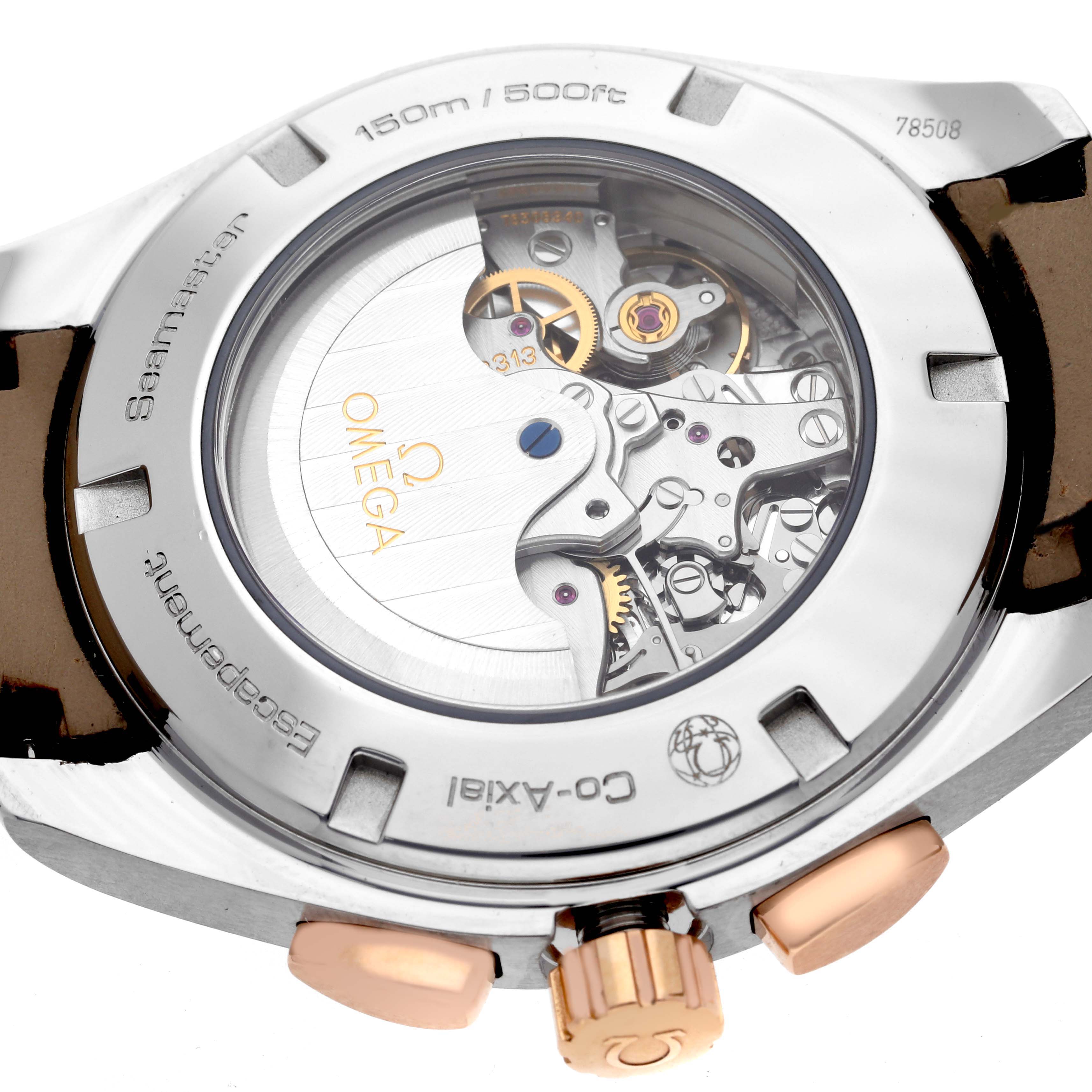 The image shows the back view of the Omega Aqua Terra 231.23.44.50.06.001 Men's Steel and Gold (two tone) Grey Dial 231.23.44.50.06.001 Men's Steel and Gold (two tone) Grey Dial, revealing its exposed movement and engravings.