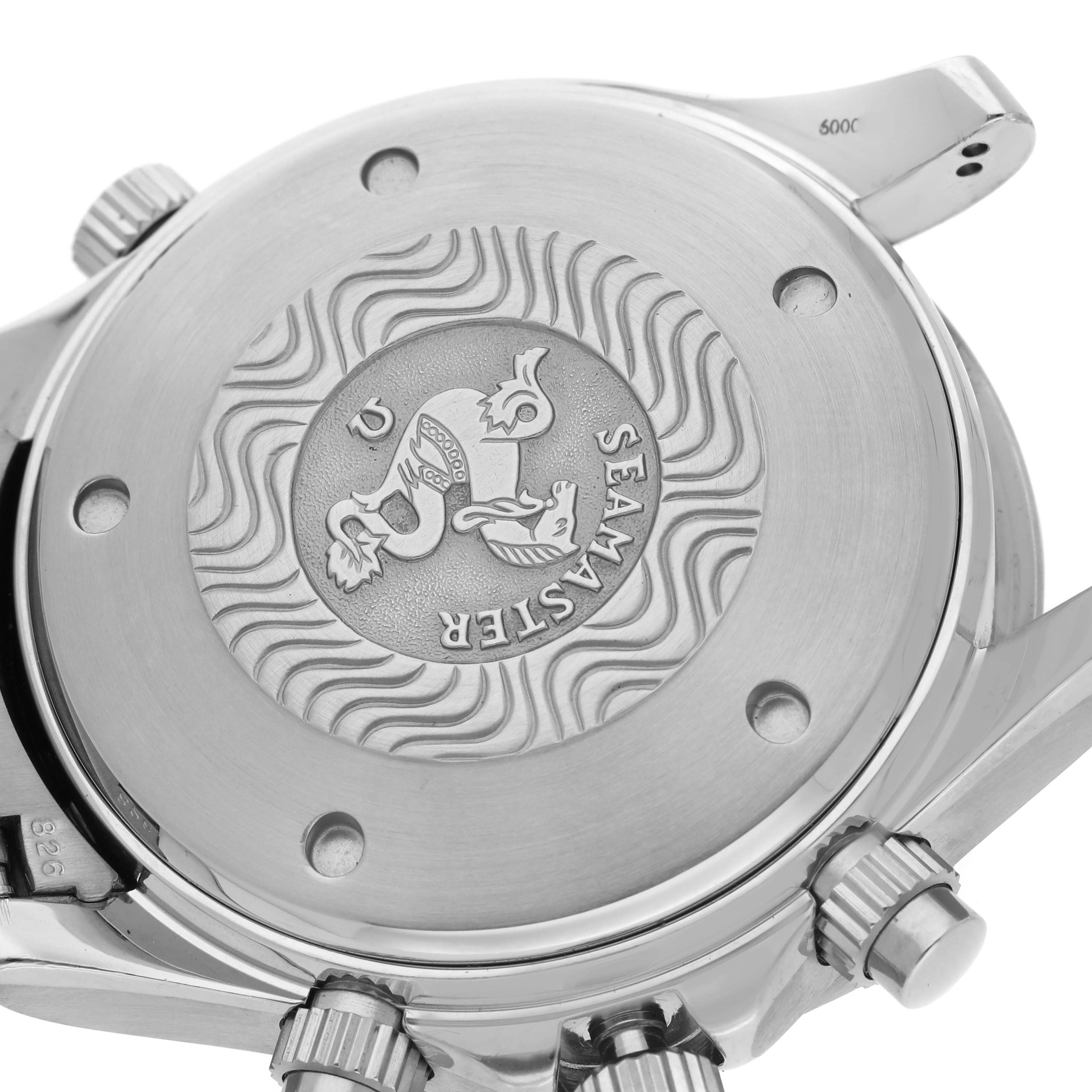 The image shows the back of an Omega Seamaster 2599.80.00 Men's Stainless Steel Blue Dial watch, highlighting its engraved medallion and crown detail.