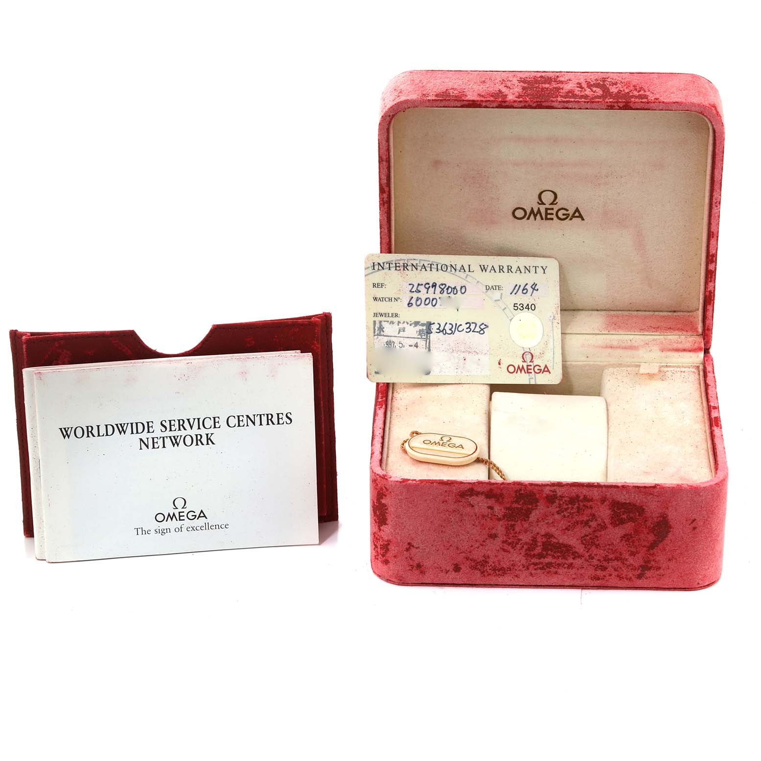 The image shows an Omega Seamaster 2599.80.00 Men's Stainless Steel Blue Dial watch box, warranty card, and service booklet at a frontal angle.