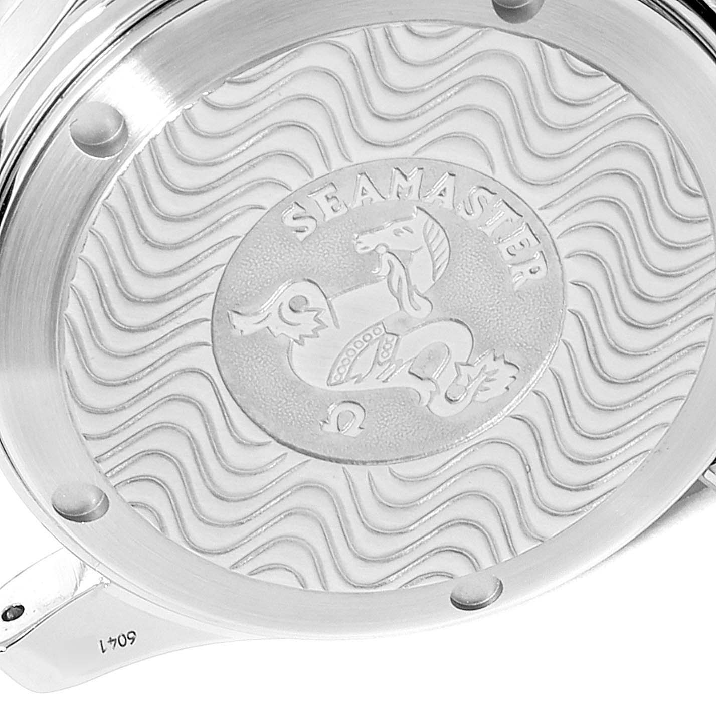 This is a close-up view of the case back of an Omega Seamaster 2551.80.00 Men
s Stainless Steel Blue Dial 2551.80.00 Men
s Stainless Steel Blue Dial watch showing the engraved logo and wavy pattern.