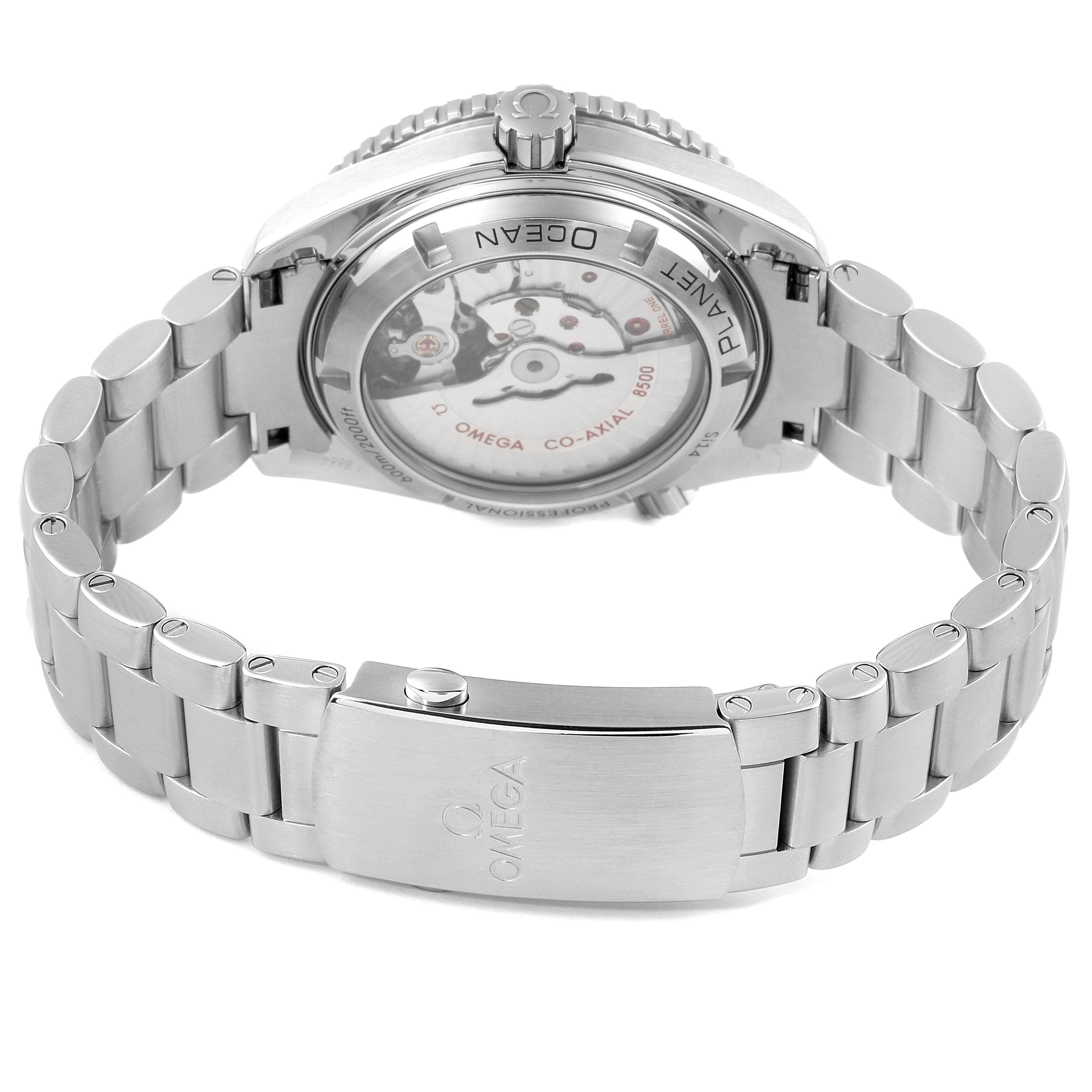 The image shows the back view of an Omega Planet Ocean 232.30.42.21.01.001 Men
s Stainless Steel Black Dial 232.30.42.21.01.001 Men
s Stainless Steel Black Dial watch, focusing on the movement and stainless steel bracelet.