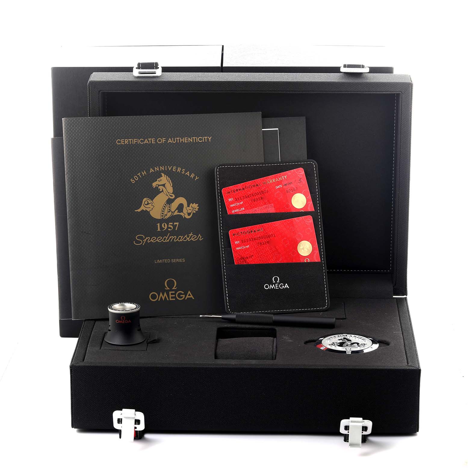 The Omega Speedmaster 311.33.42.50.01.001 Men's Stainless Steel Black Dial 311.33.42.50.01.001 Men's Stainless Steel Black Dial package includes authenticity documents, warranty cards, a loupe, and a watch tool, shown from a front angle.