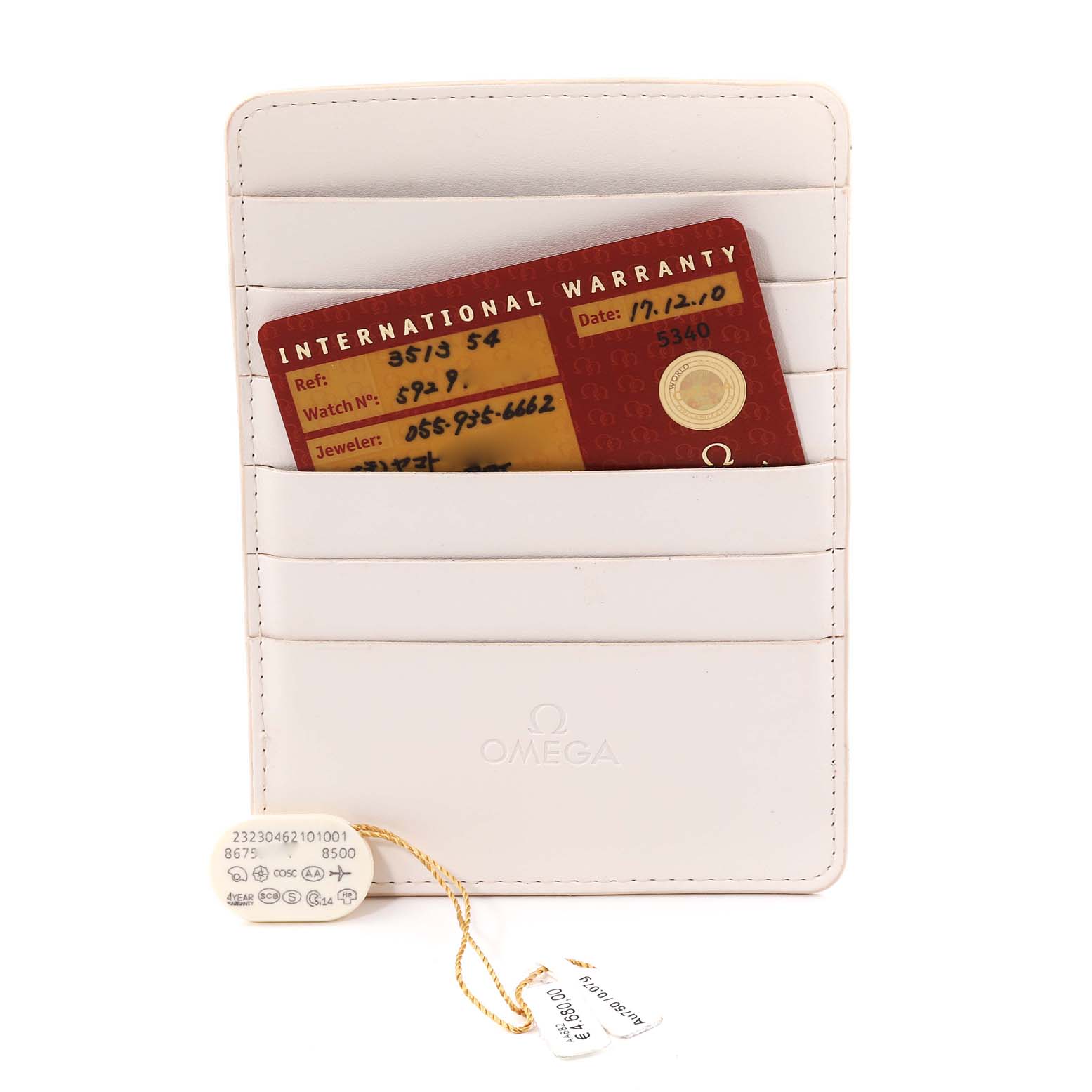 The image shows Omega Speedmaster 3513.54.00 Men
s Stainless Steel Black Dial 3513.54.00 Men
s Stainless Steel Black Dial watch accessories including the International Warranty card and a tag in a white card holder.